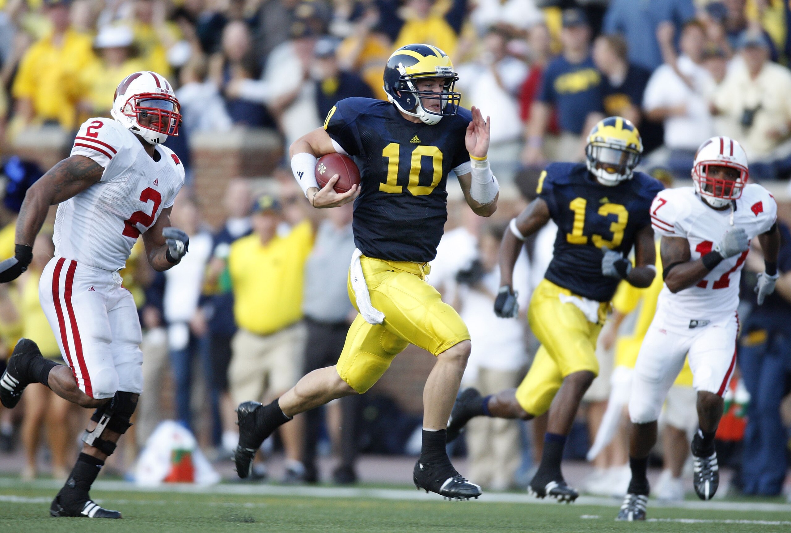 ANN ARBOR, MI - SEPTEMBER 27: Steven Threet #10 of the Michigan Wolverines rushes for a 58 yard fourth quarter gain while being pursued by Jonathan Casillas #2 the Wisconsin Badgers on September 27, 2008 at Michigan Stadium in Ann Arbor, Michigan. (Photo 