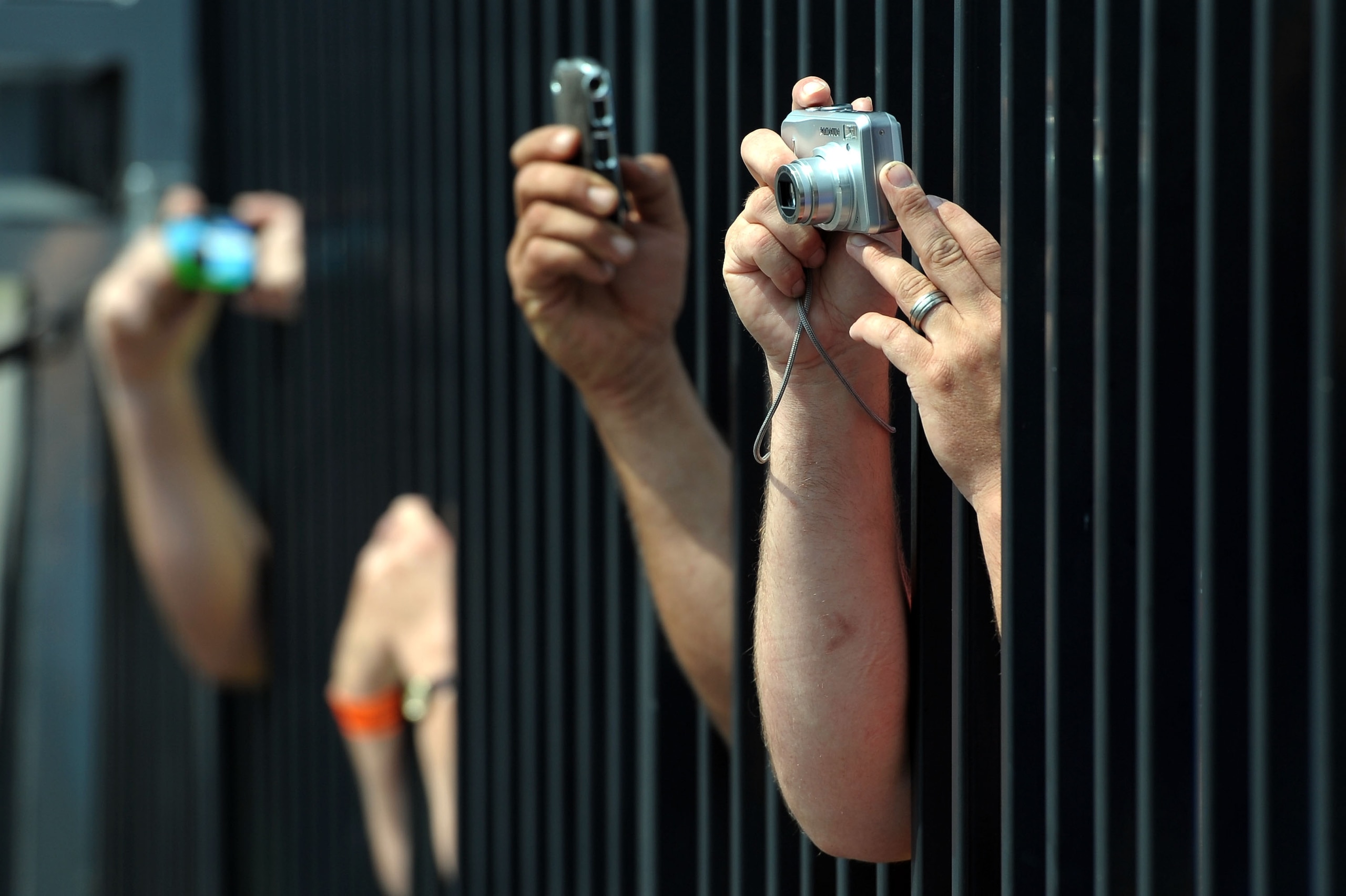 LONG POND, PA - JUNE 05:  Fans take picture in the garage area during practice for the NASCAR Sprint Cup Series Gillette Fusion ProGlide 500 at Pocono Raceway on June 5, 2010 in Long Pond, Pennsylvania.  (Photo by Drew Hallowell/Getty Images for NASCAR)