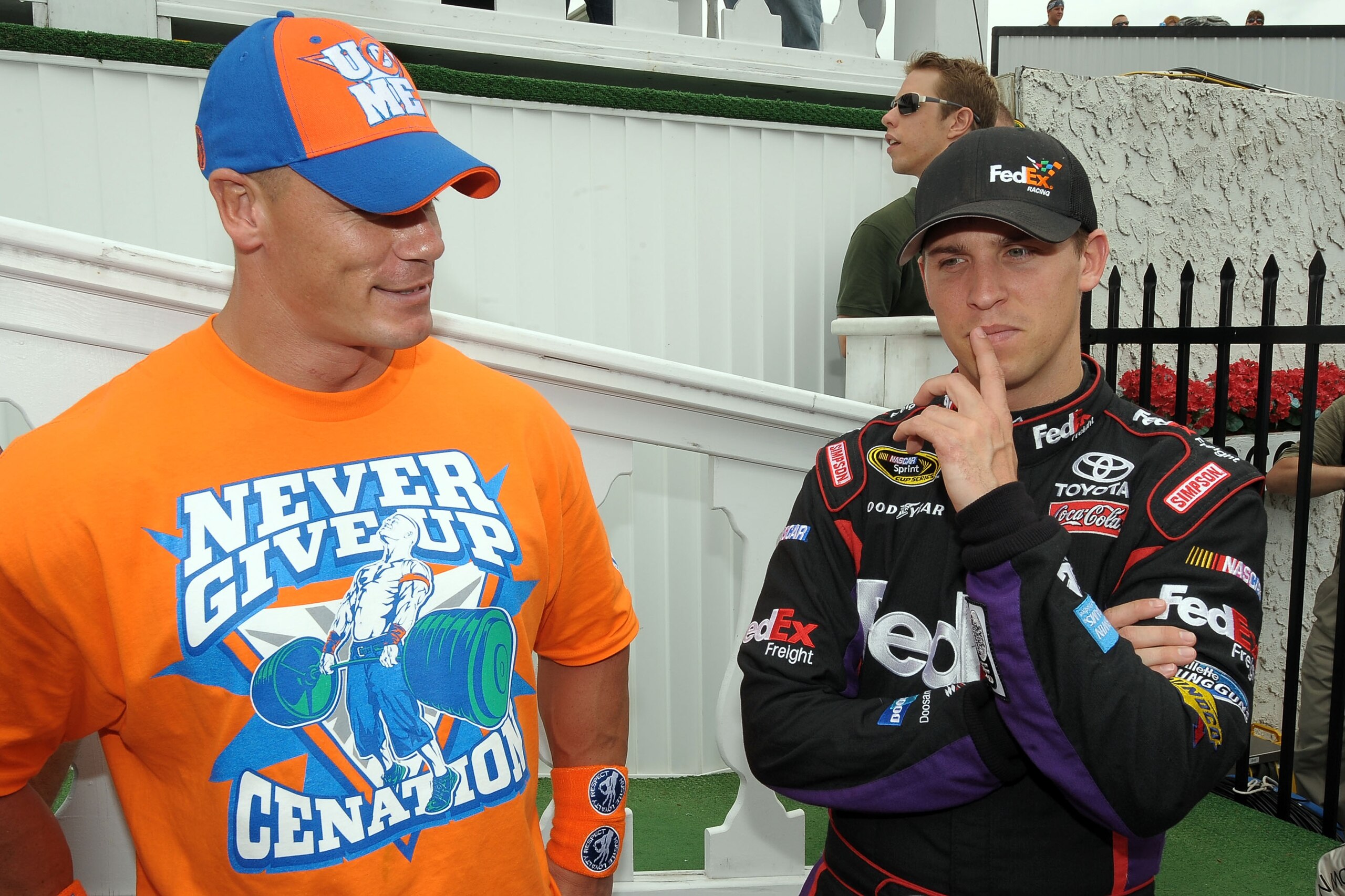LONG POND, PA - JUNE 06: WWE champion and co-grand marshal John Cena (L) and Denny Hamlin, driver of the #11 FedEx Freight Toyota, talk in Victory Lane prior to the NASCAR Sprint Cup Series Gillette Fusion ProGlide 500 at Pocono Raceway on June 6, 2010 i LONG POND, PA - JUNE 06: WWE champion and co-grand marshal John Cena (L) and Denny Hamlin, driver of the #11 FedEx Freight Toyota, talk in Victory Lane prior to the NASCAR Sprint Cup Series Gillette Fusion ProGlide 500 at Pocono Raceway on June 6, 2010 i