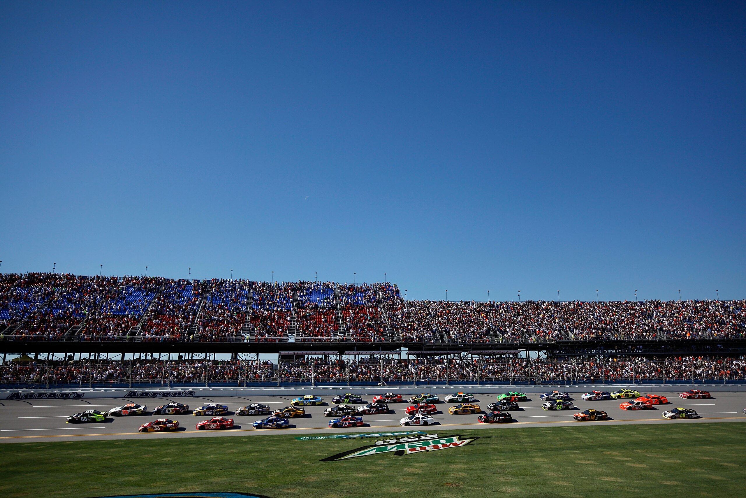 TALLADEGA, AL - OCTOBER 31: A general view of cars racing during the NASCAR Sprint Cup Series AMP Energy Juice 500 at Talladega Superspeedway on October 31, 2010 in Talladega, Alabama. (Photo by Chris Graythen/Getty Images) TALLADEGA, AL - OCTOBER 31: A general view of cars racing during the NASCAR Sprint Cup Series AMP Energy Juice 500 at Talladega Superspeedway on October 31, 2010 in Talladega, Alabama. (Photo by Chris Graythen/Getty Images)