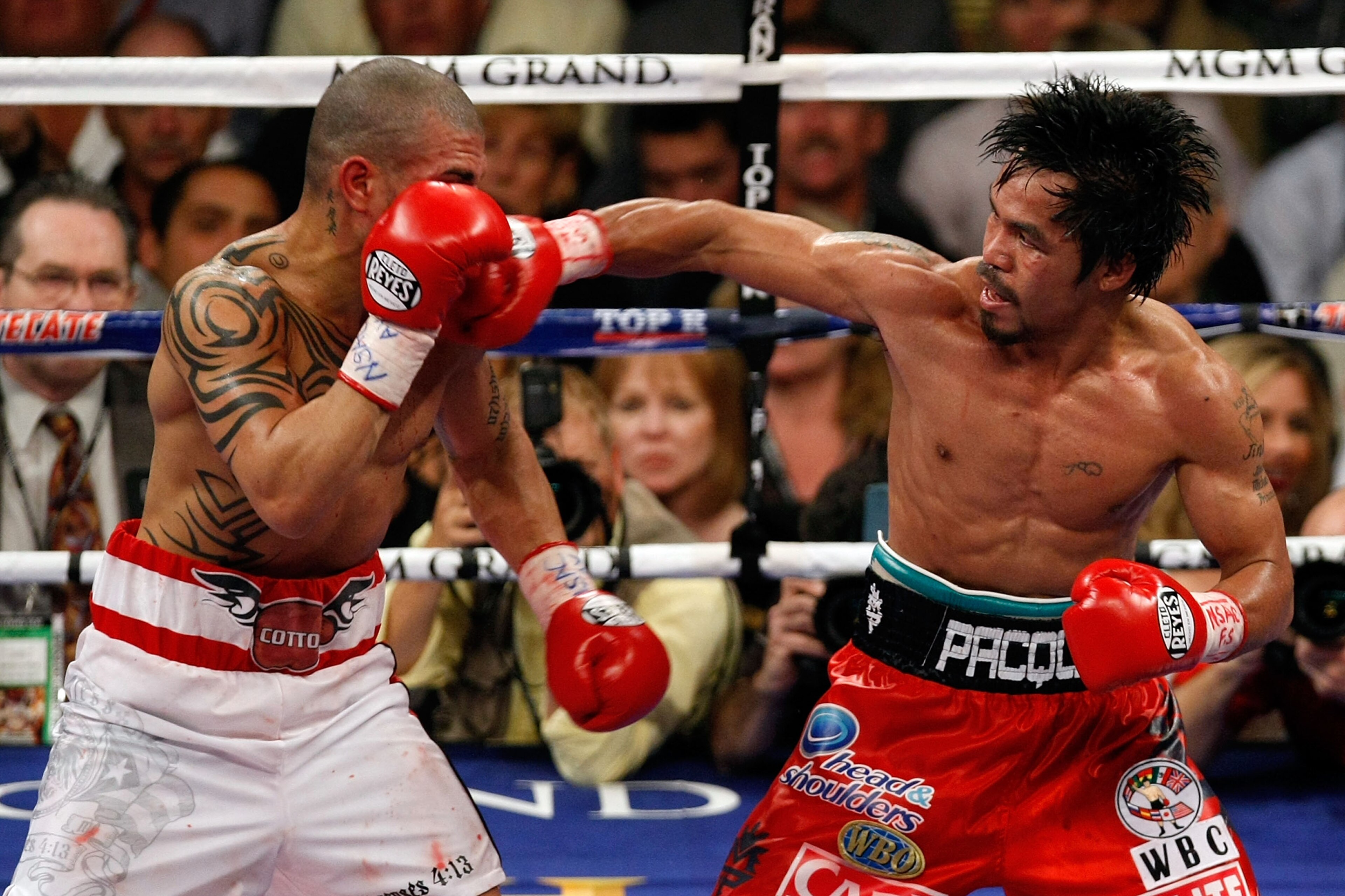 LAS VEGAS - NOVEMBER 14:  (R-L) Manny Pacquiao throws a right to the head of Miguel Cotto during their WBO welterweight title fight at the MGM Grand Garden Arena on November 14, 2009 in Las Vegas, Nevada. Pacquiao defeated Cotto by 12th round TKO.  (Photo