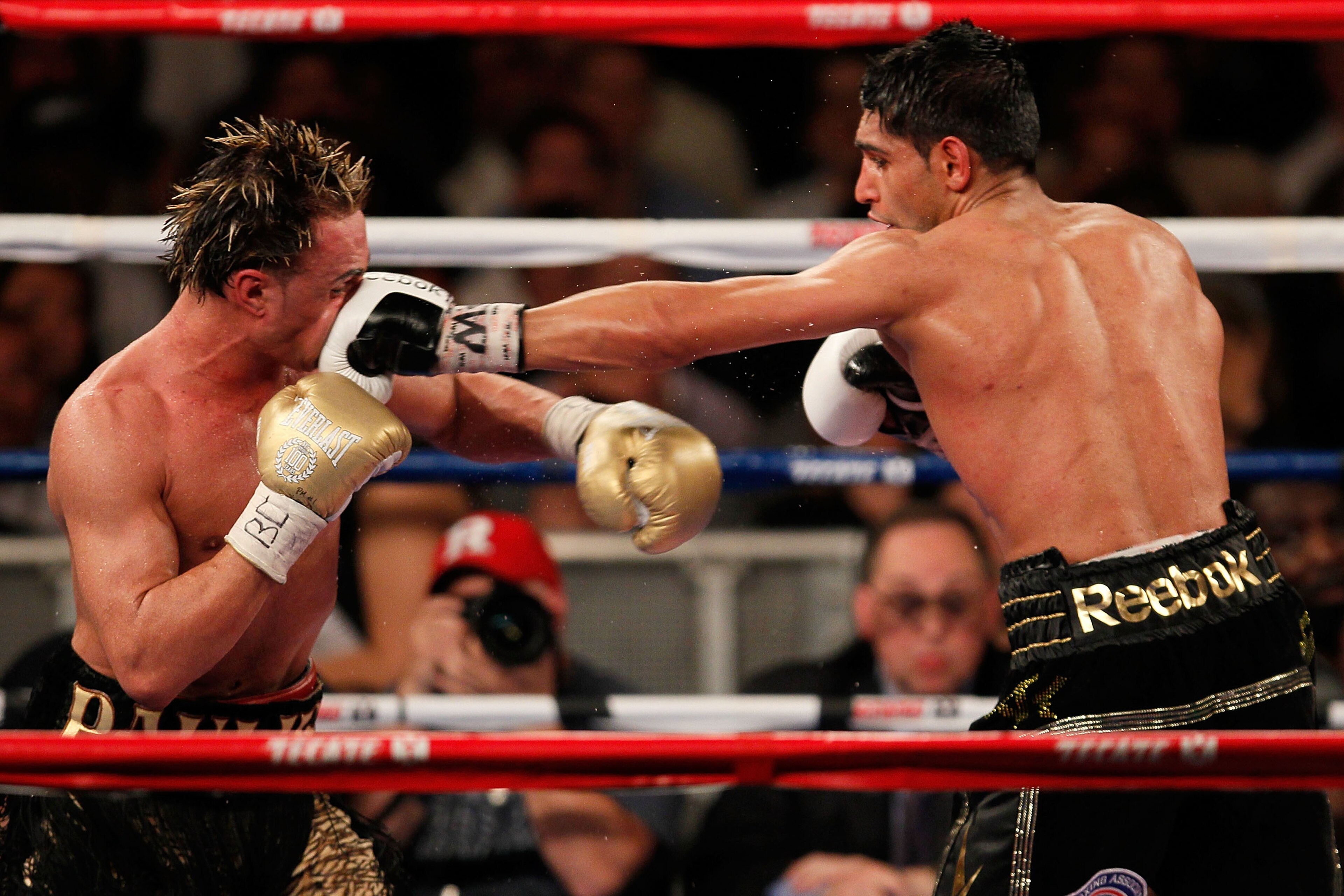 NEW YORK - MAY 15:  Amir Khan (R) of Great Britain and Paulie Malignaggi exchange blows during the WBA light welterweight title fight at Madison Square Garden on May 15, 2010 in New York City.  (Photo by Chris Trotman/Getty Images)