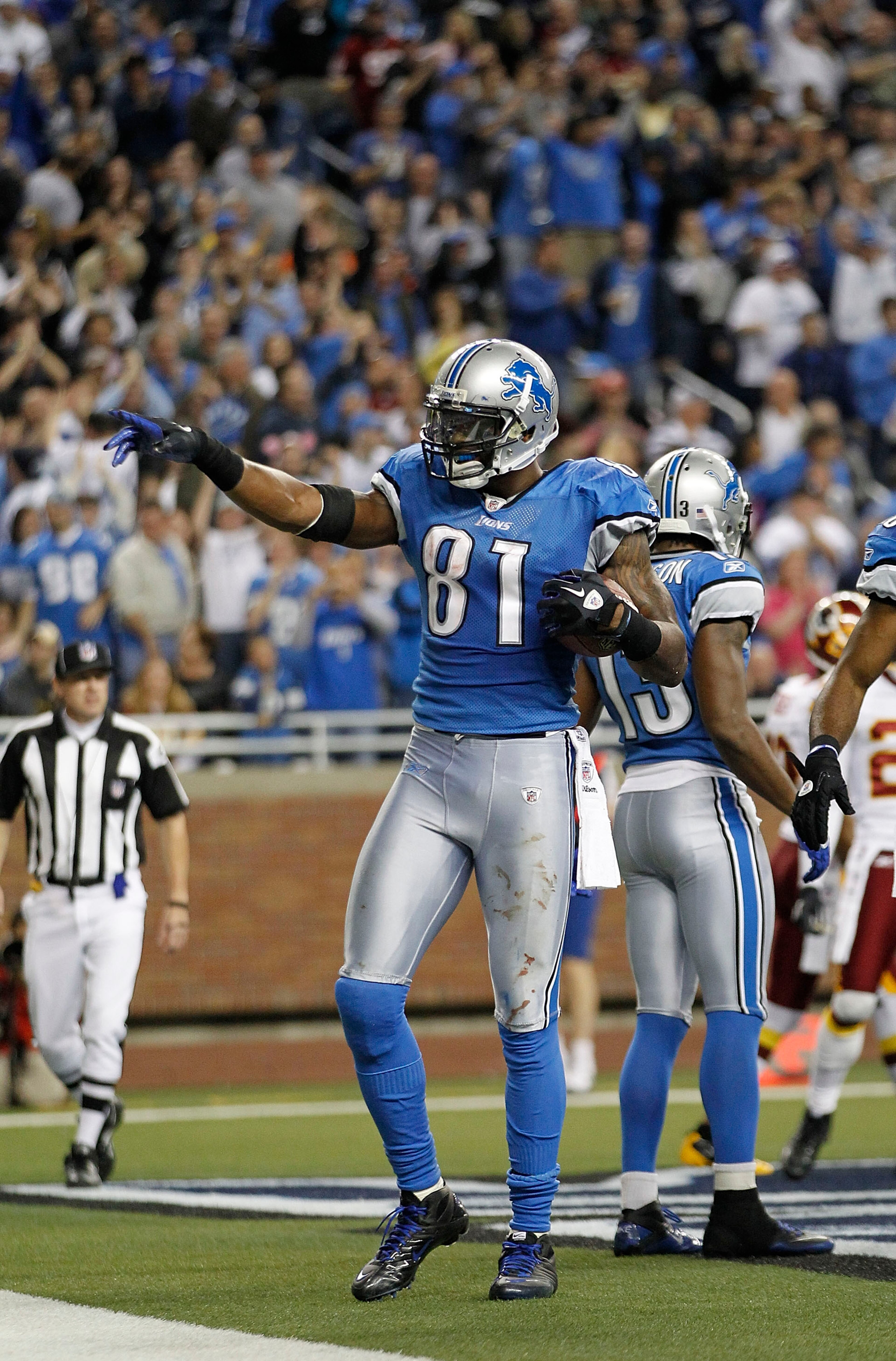 DETROIT - OCTOBER 31:  Calvin Johnson #81 of the Detroit Lions celebrates after scoring a touchdown during the fourth quarter of the game against the Washington Redskins at Ford Field on October 31, 2010 in Detroit, Michigan. The Lions defeated the Redski