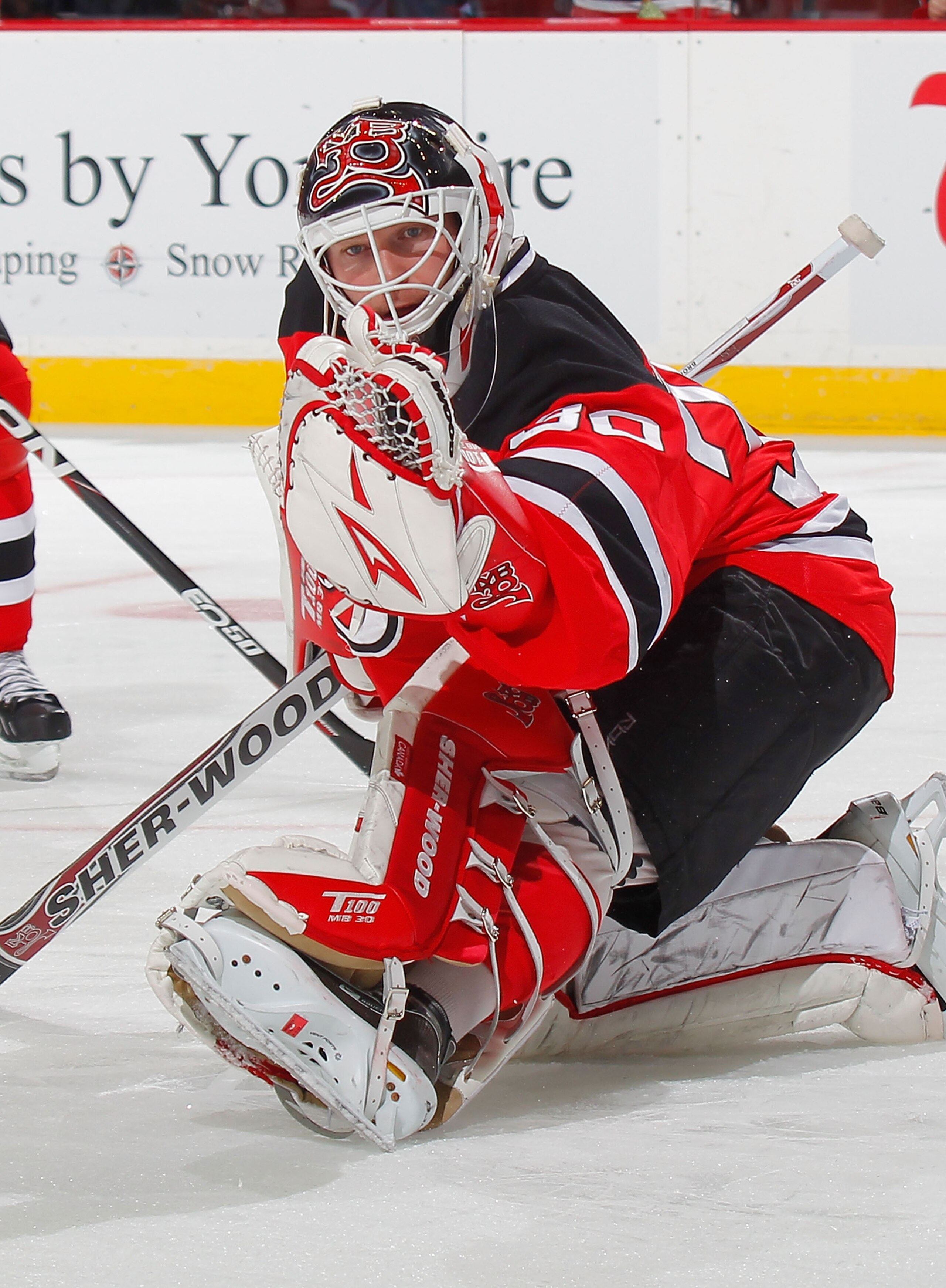 NEWARK, NJ - NOVEMBER 12:  Goalie Martin Brodeur of the New Jersey Devils makes a gloves save during warmups before a hockey game against the Edmonton Oilers at the Prudential Center on November 12, 2010 in Newark, New Jersey.  (Photo by Paul Bereswill/Ge