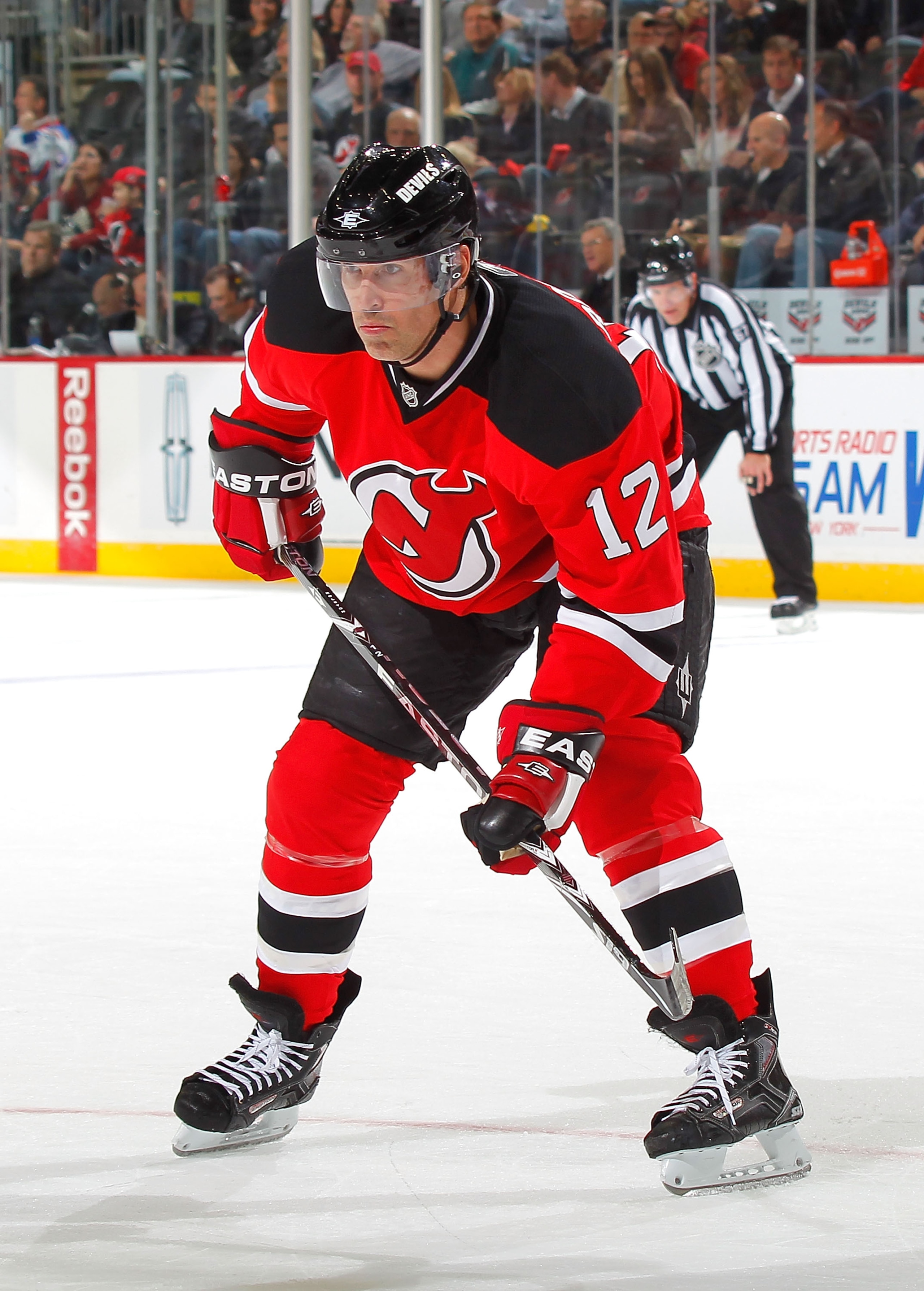 NEWARK, NJ - NOVEMBER 12:  Brian Rolston #12 of the New Jersey Devils watches the puck during a hockey game against the Edmonton Oilers at the Prudential Center on November 12, 2010 in Newark, New Jersey.  (Photo by Paul Bereswill/Getty Images)
