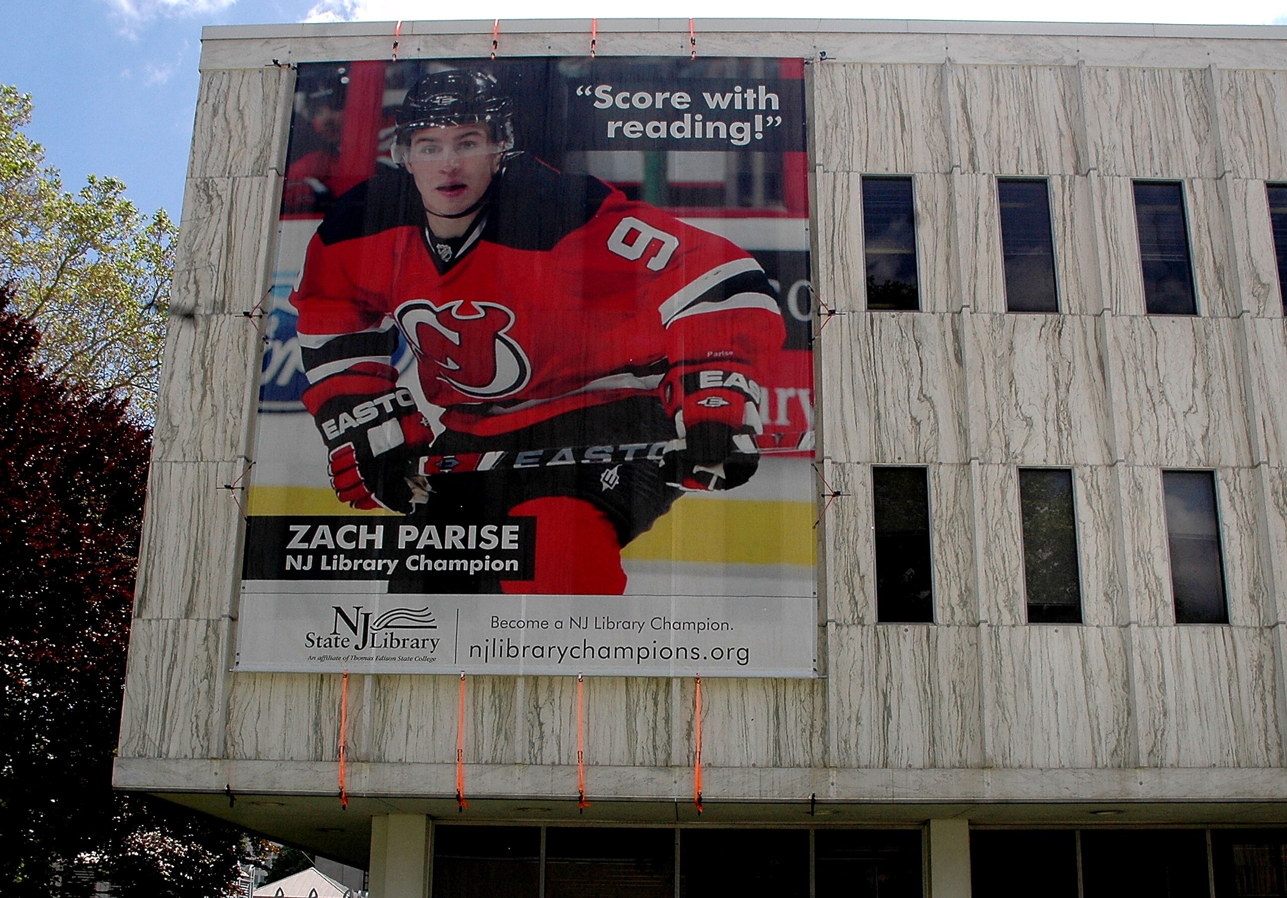 TRENTON, NJ - MAY 25: A banner of New Jersey Devils forward Zach Parise adorns the side of the State Library during Zach Parise Reads to Students at the State Library on May 25, 2010 in Trenton, New Jersey.  (Photo by Andy Marlin/Getty Images for the New