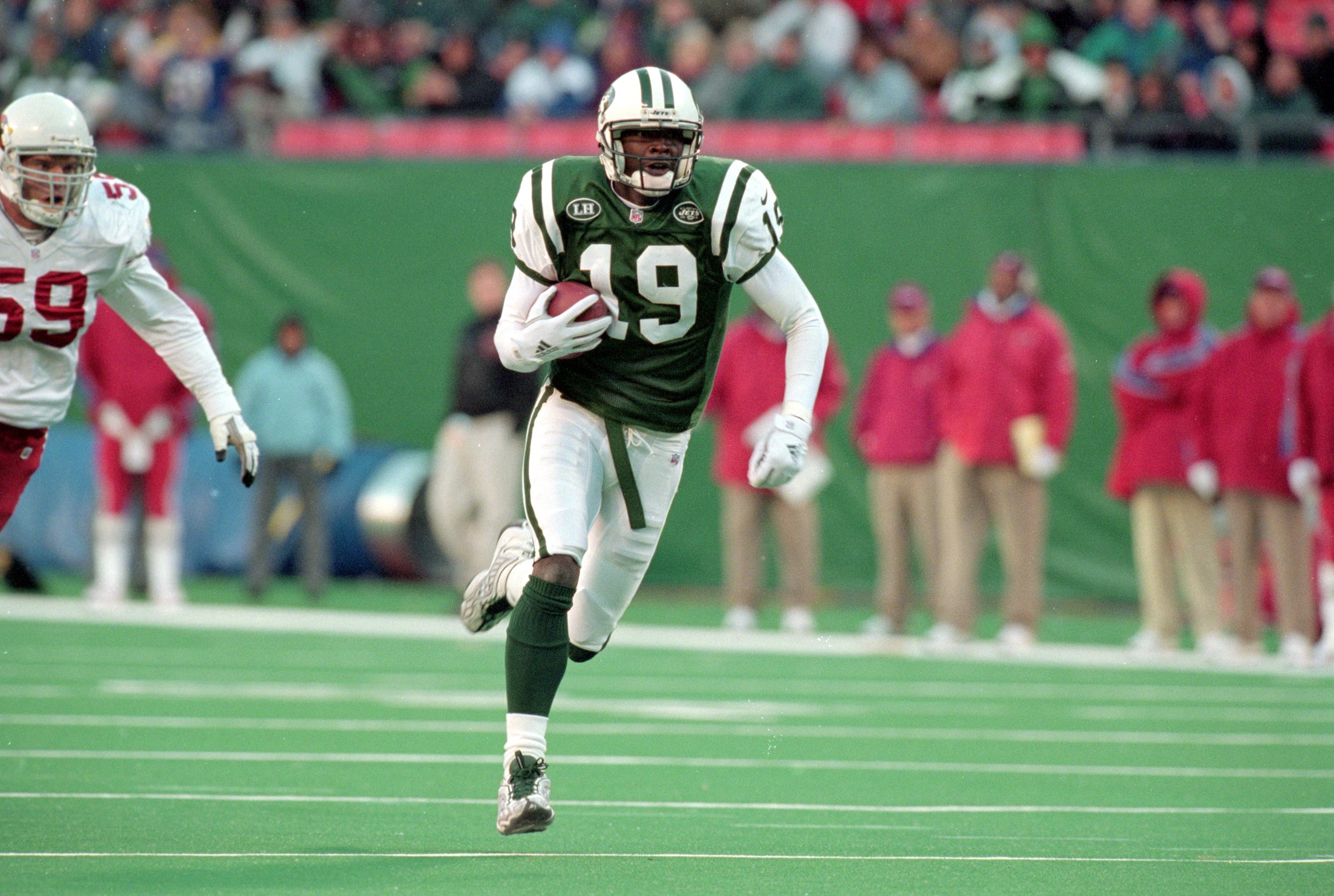 7 Nov 1999: Keyshawn Johnson #19 of the New York Jets carries the ball during a game against the Arizona Cardinals at Giants Stadium in East Rutherford, New Jersey. The Jets defeated the Cardinals 12-7.