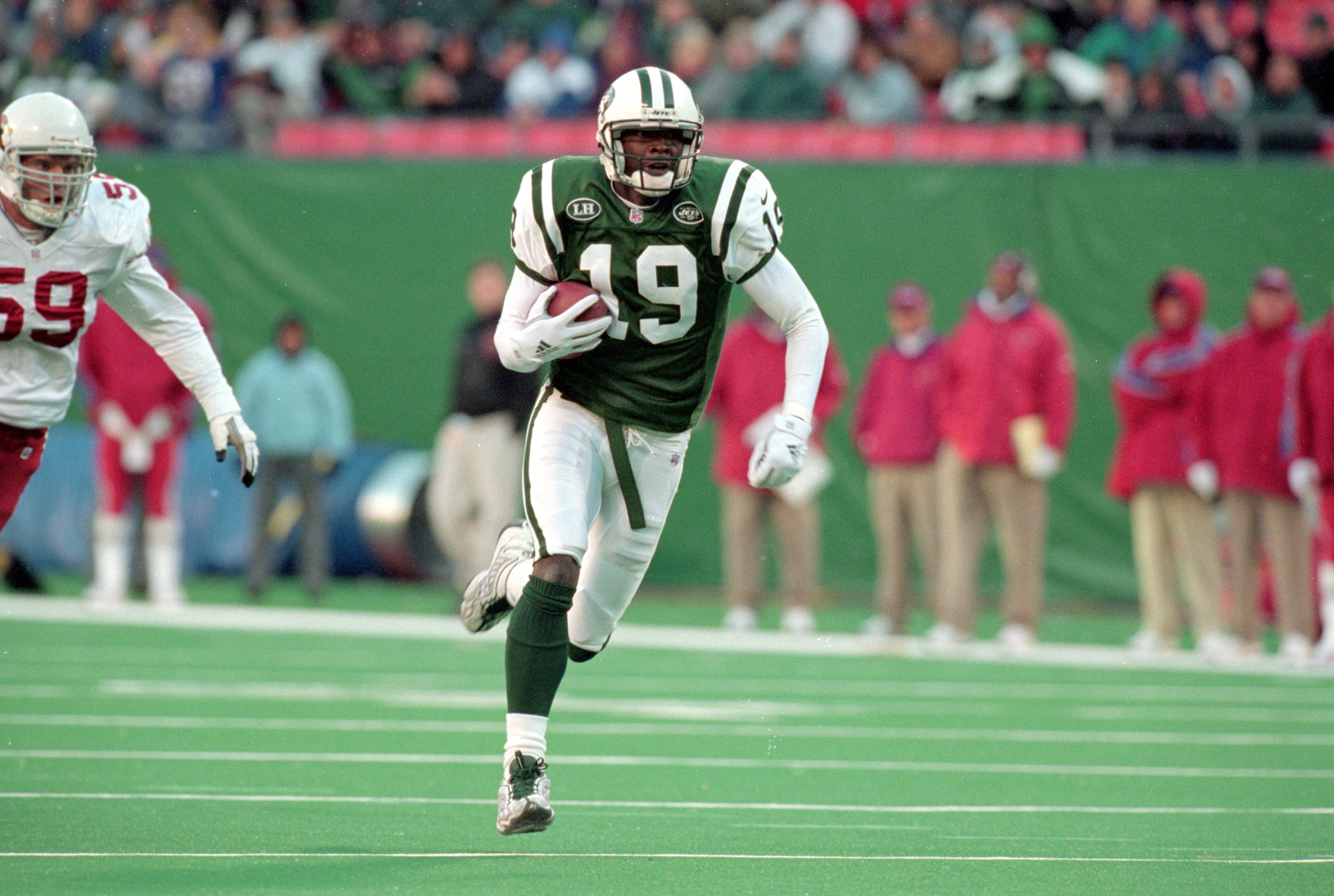 7 Nov 1999: Keyshawn Johnson #19 of the New York Jets carries the ball during a game against the Arizona Cardinals at Giants Stadium in East Rutherford, New Jersey. The Jets defeated the Cardinals 12-7.