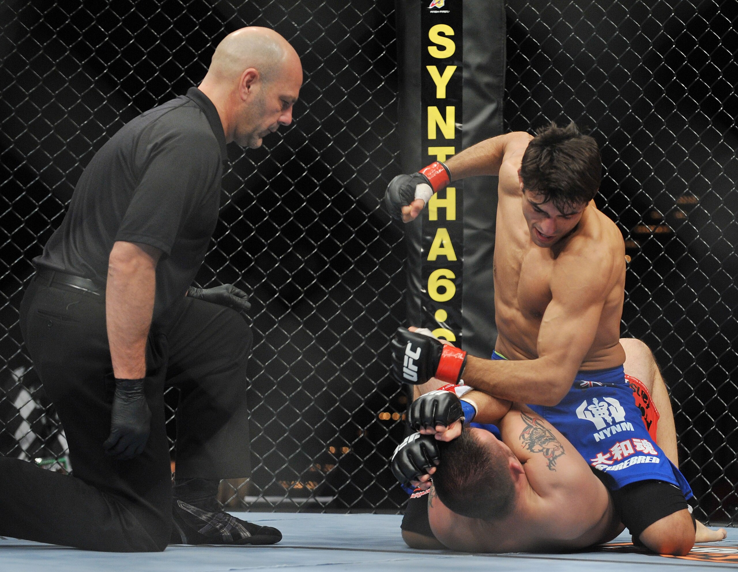 LAS VEGAS - NOVEMBER 21: George Sotiropoulos (Top) battles Jason Dent (Bottom) during their Lightweight Fight at the UFC 106 at Mandalay Bay Events Center on November 21, 2009 in Las Vegas, Nevada. (Photo by Jon Kopaloff/Getty Images)