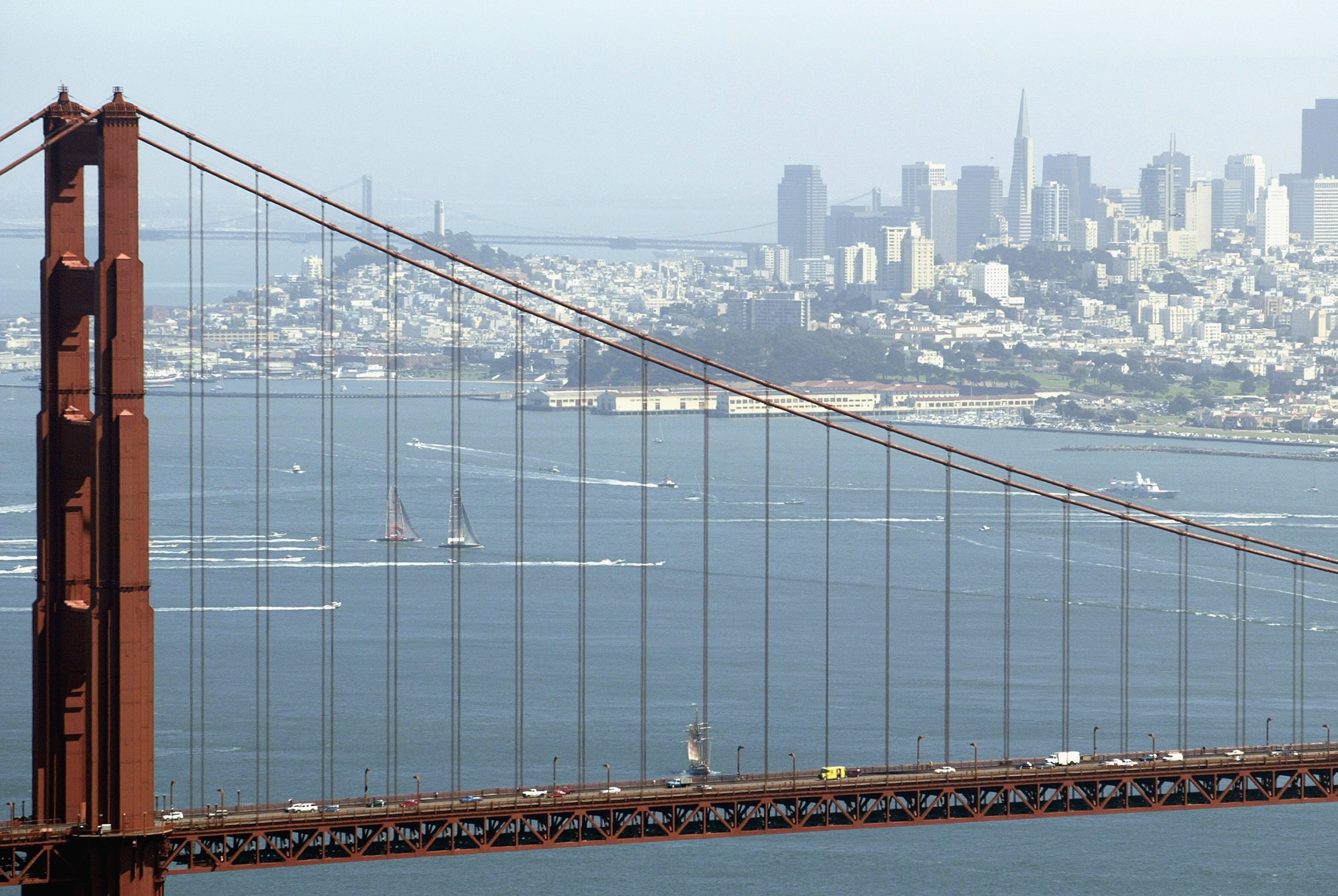 SAN FRANCISCO - SEPTEMBER 16:  Swiss Team Alinghi headed by Ernesto Bertarelli and Oracle BMW Racing team headed by Larry Ellison race during the Moet Cup in the San Francisco Bay on September 16, 2003 in San Francisco, California.  (Photo by Jed Jacobsoh