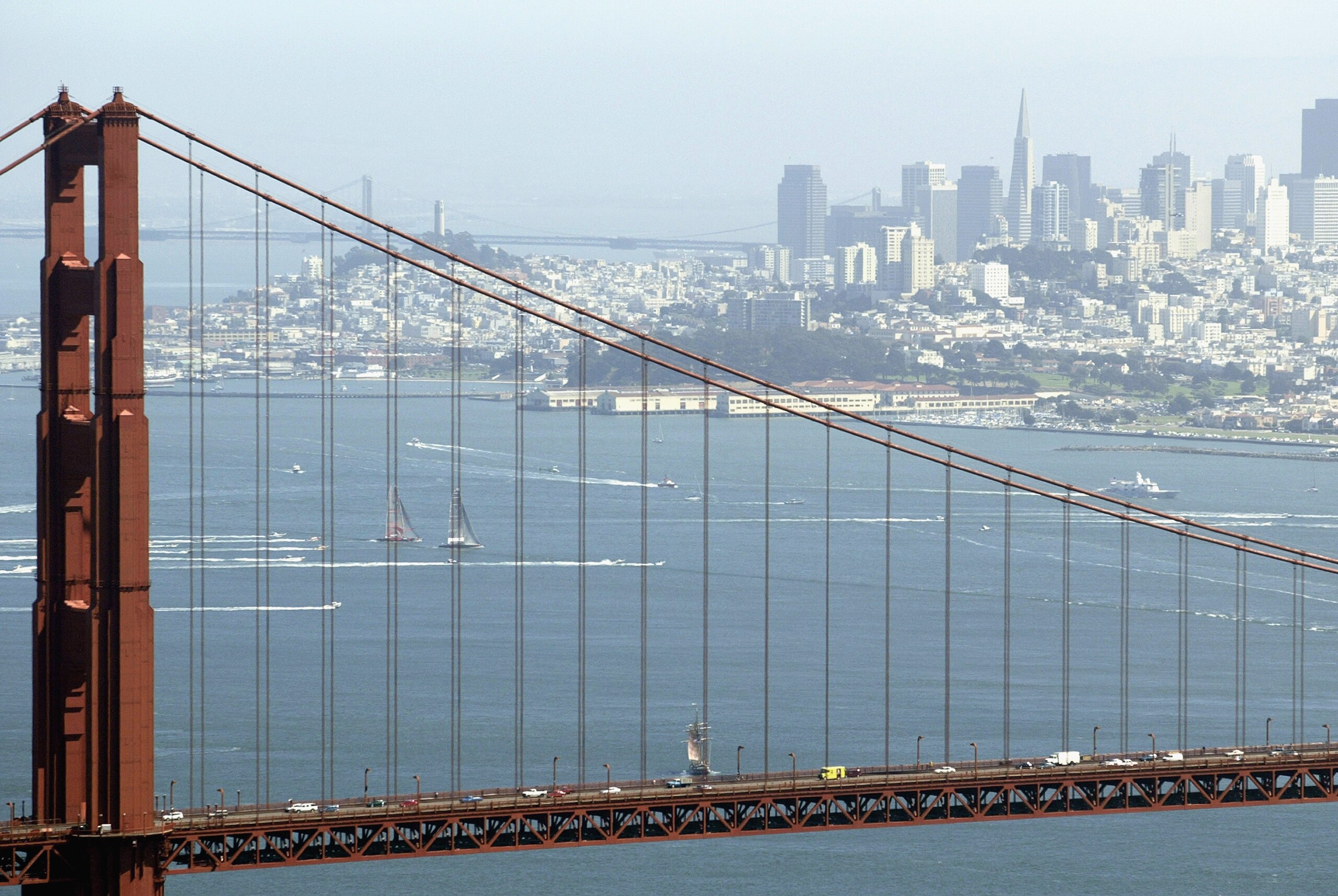 SAN FRANCISCO - SEPTEMBER 16:  Swiss Team Alinghi headed by Ernesto Bertarelli and Oracle BMW Racing team headed by Larry Ellison race during the Moet Cup in the San Francisco Bay on September 16, 2003 in San Francisco, California.  (Photo by Jed Jacobsoh