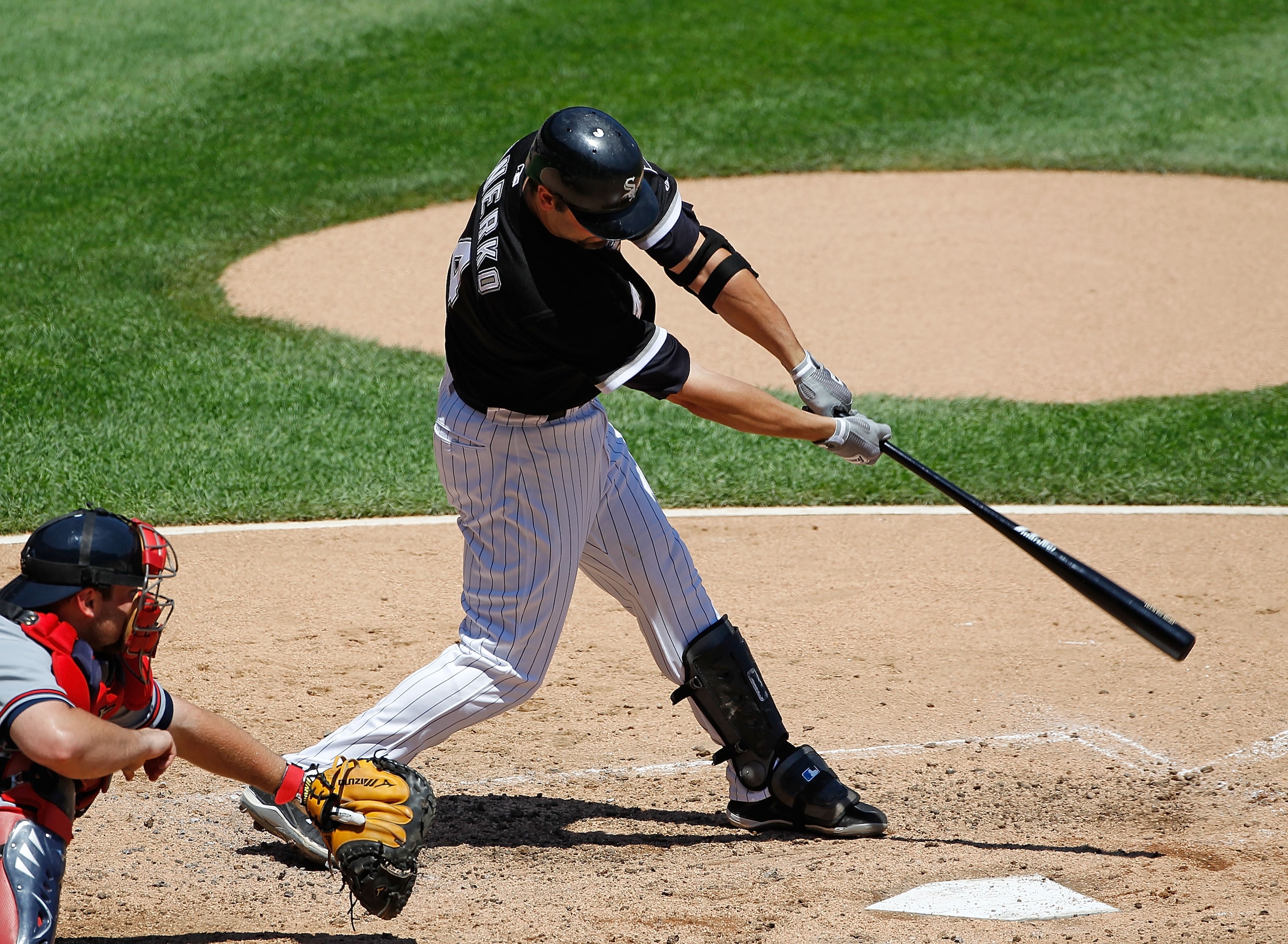 CHICAGO - JUNE 24: Paul Konerko #14 of the Chicago White Sox takes a swing against the Atlanta Braves at U.S. Cellular Field on June 24, 2010 in Chicago, Illinois. The White defeated the Braves 2-0.  (Photo by Jonathan Daniel/Getty Images)