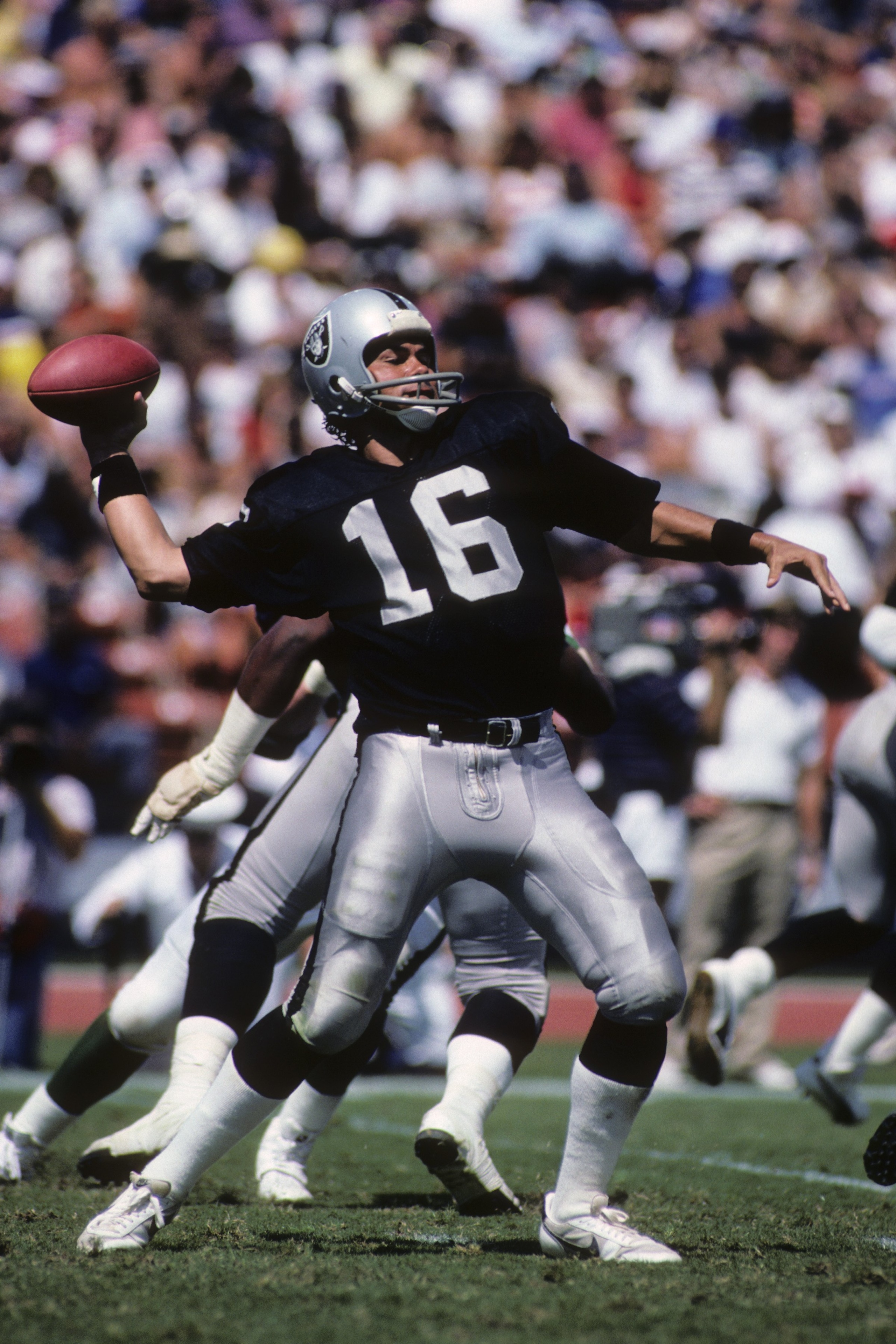 LOS ANGELES - SEPTEMBER 8:  Quarterback Jim Plunkett #16 of the Los Angeles Raiders passes the ball during the game against the New York Jets during the game at the Los Angeles Memorial Coliseum on September 8, 1985 in Los Angeles, California.  The Raider