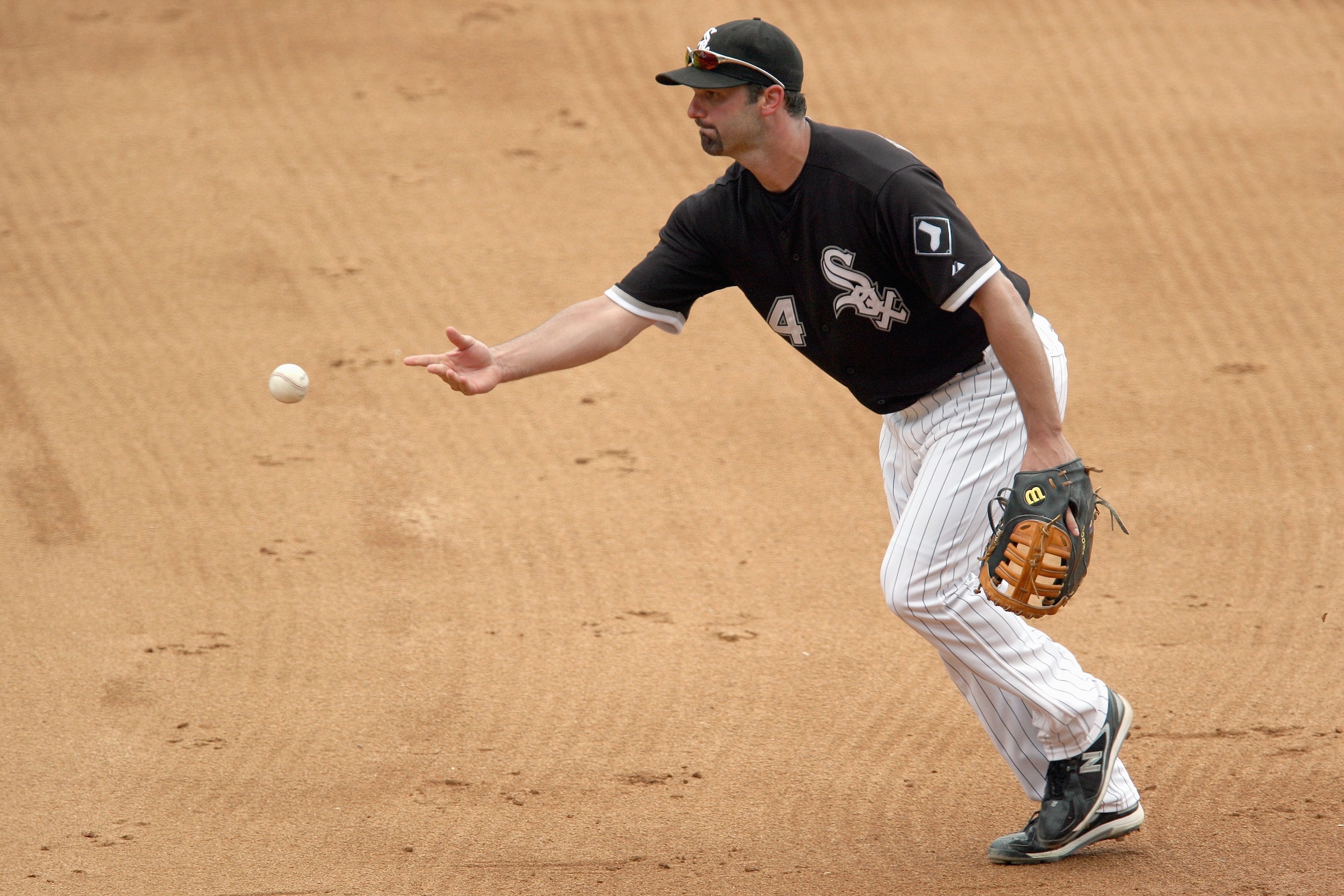 CHICAGO - AUGUST 23:  Paul Konerko #14 of the Chicago White Sox tosses the ball during the game against the Tampa Bay Rays on August 23, 2008 at U.S. Cellular Field in Chicago, Illinois. (Photo by Jonathan Daniel/Getty Images)