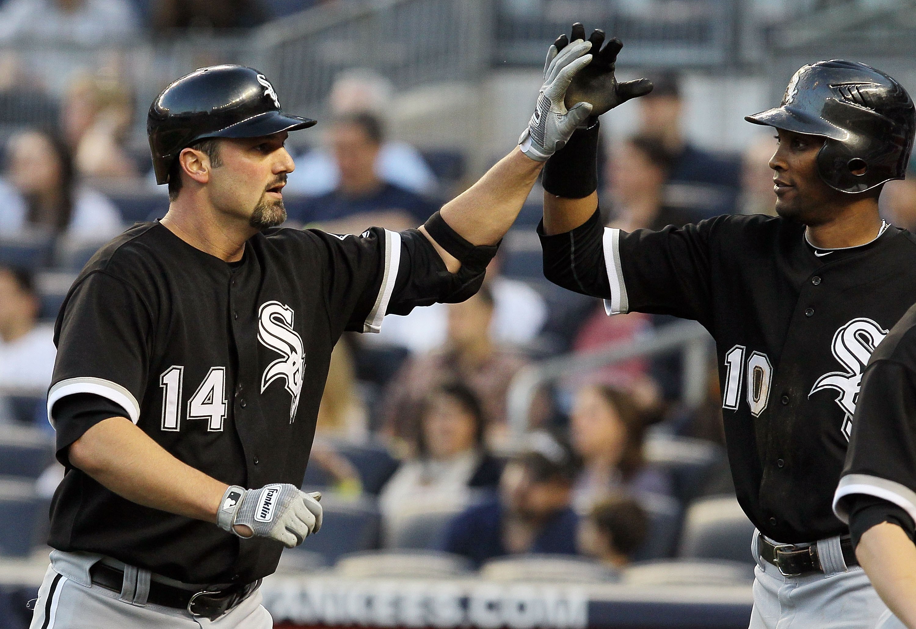 NEW YORK - APRIL 30:  Paul Konerko #14 of the Chicago White Sox celebrates his first inning three run home run against the New York Yankees with teammate Alexei Ramirez #10 on April 30, 2010 at Yankee Stadium in the Bronx borough of New York City.  (Photo