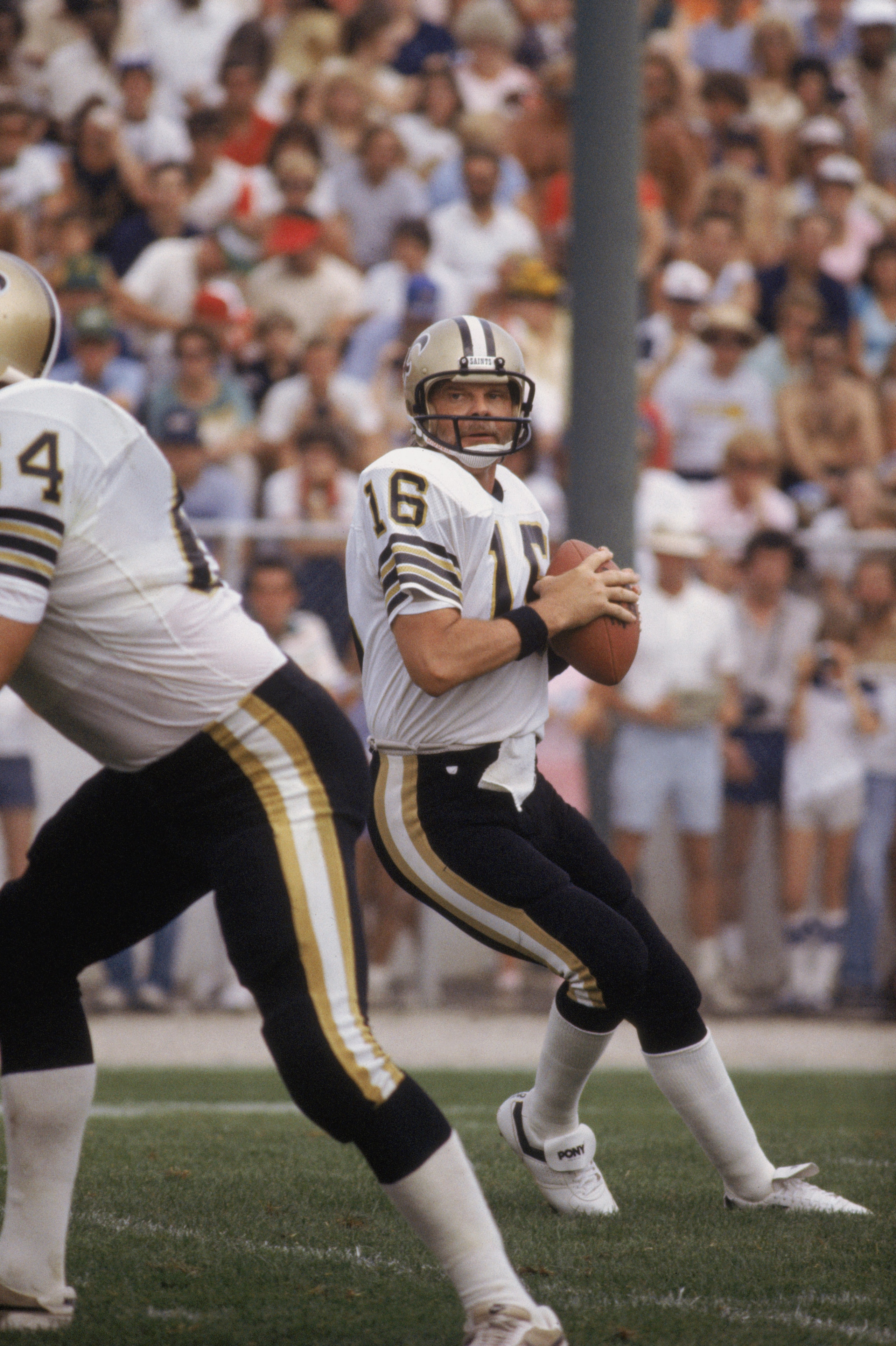 CANTON, OH - 1983:  Quarterback Ken Stabler #16 of the New Orleans Saints drops back to pass during the NFL Hall of Fame Game at Fawcett Stadium in Canton, Ohio in 1983.  (Photo by Jonathan Daniel/ Getty Images)