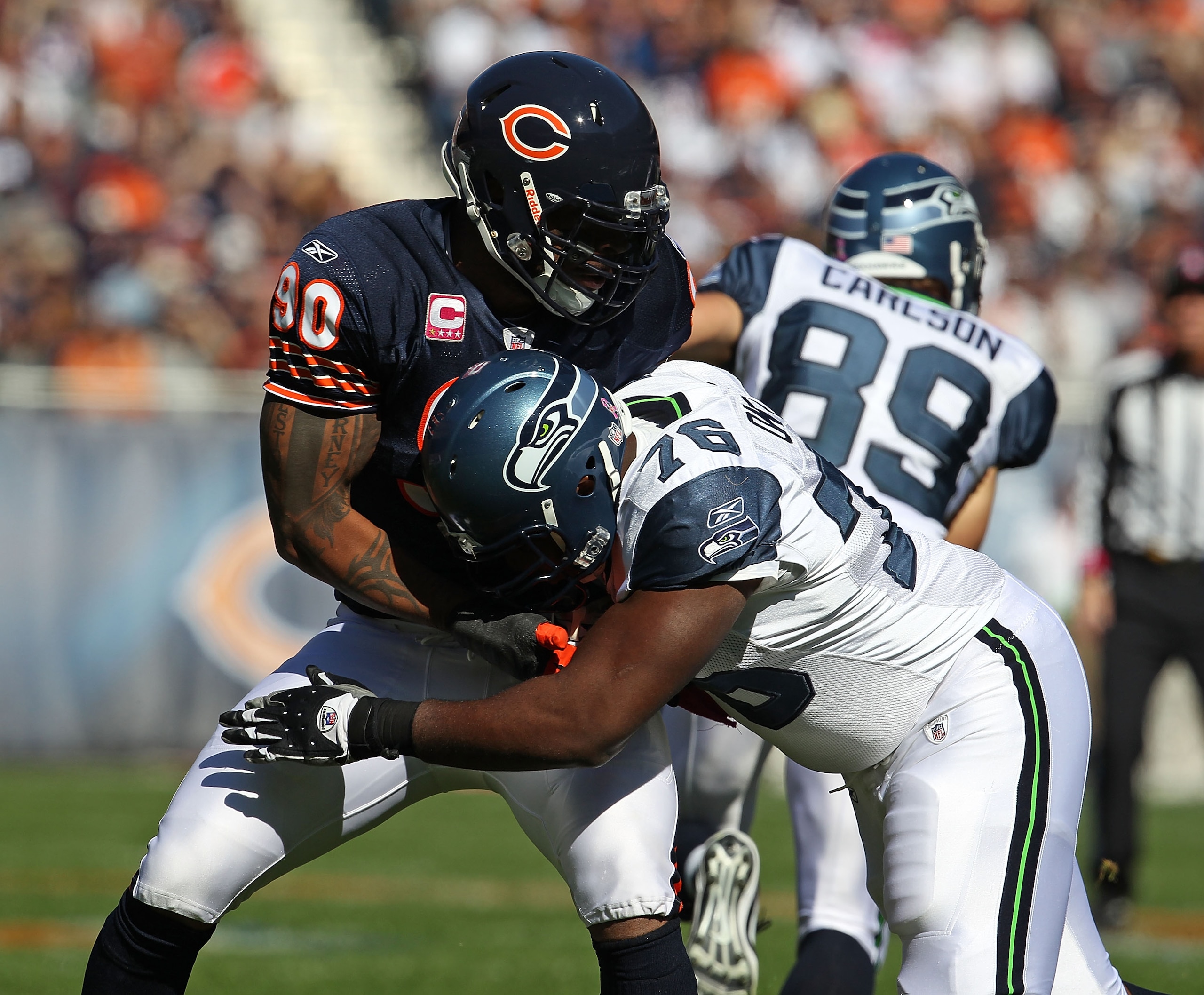 CHICAGO - OCTOBER 17: Julius Peppers #90 of the Chicago Bears rushes against Russell Okung #76 of the Seattle Seahawks at Soldier Field on October 17, 2010 in Chicago, Illinois. The Seahawks defeated the Bears 23-20. (Photo by Jonathan Daniel/Getty Images