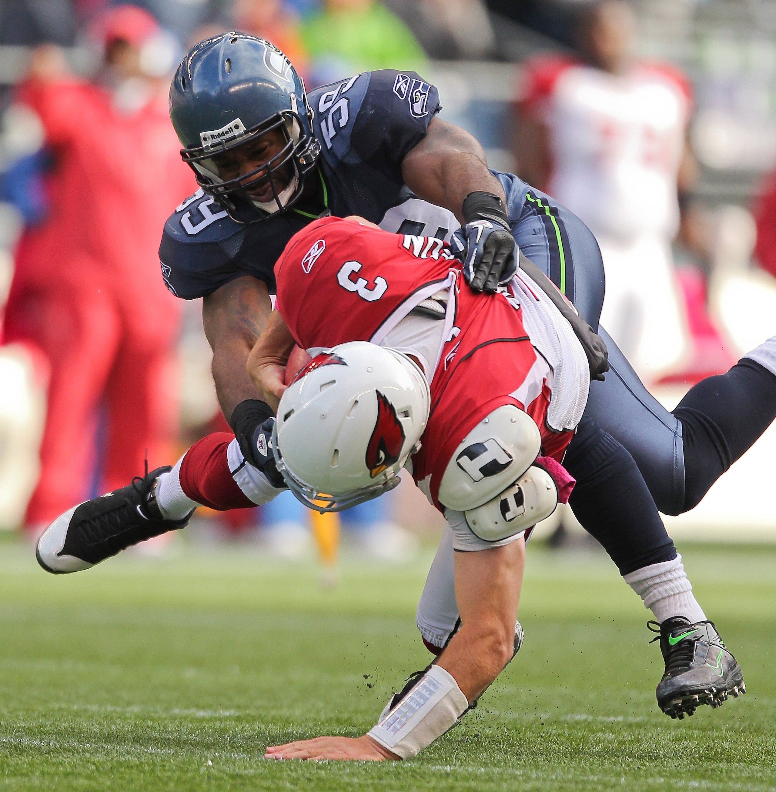 SEATTLE - OCTOBER 24:  Quarterback Derek Anderson #3 of the Arizona Cardinals is sacked by Aaron Curry #59 of the Seattle Seahawks at Qwest Field on October 24, 2010 in Seattle, Washington. The Seahawks defeated the Cardinals 22-10. (Photo by Otto Greule