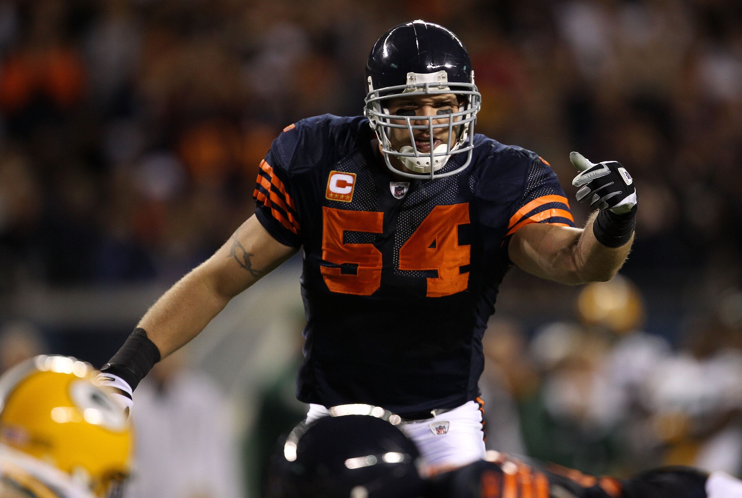 CHICAGO - SEPTEMBER 27:  Brian Urlacher #54 of the Chicago Bears gestures at the line of scrimmage against the Green Bay Packers at Soldier Field on September 27, 2010 in Chicago, Illinois.  (Photo by Jonathan Daniel/Getty Images)