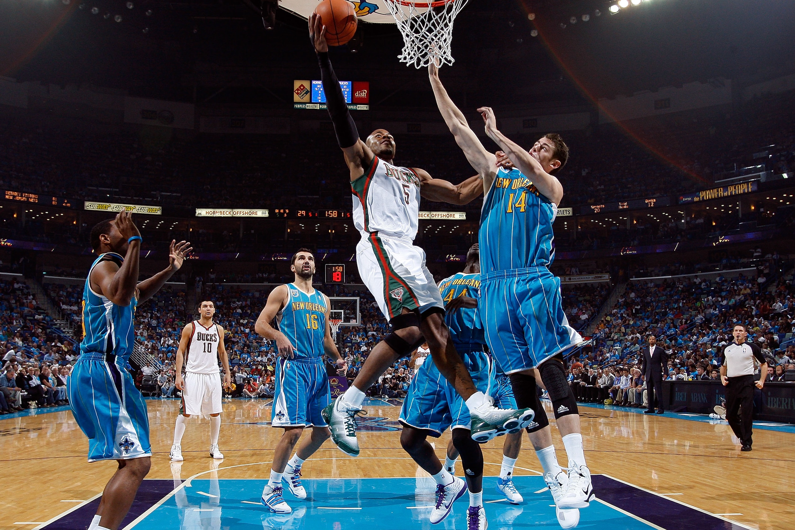NEW ORLEANS - OCTOBER 27:  Corey Maggette #5 of the Milwaukee Bucks shoots the ball over Jason Smith #14 of the New Orleans Hornets at the New Orleans Arena on October 27, 2010 in New Orleans, Louisiana.  NOTE TO USER: User expressly acknowledges and agre