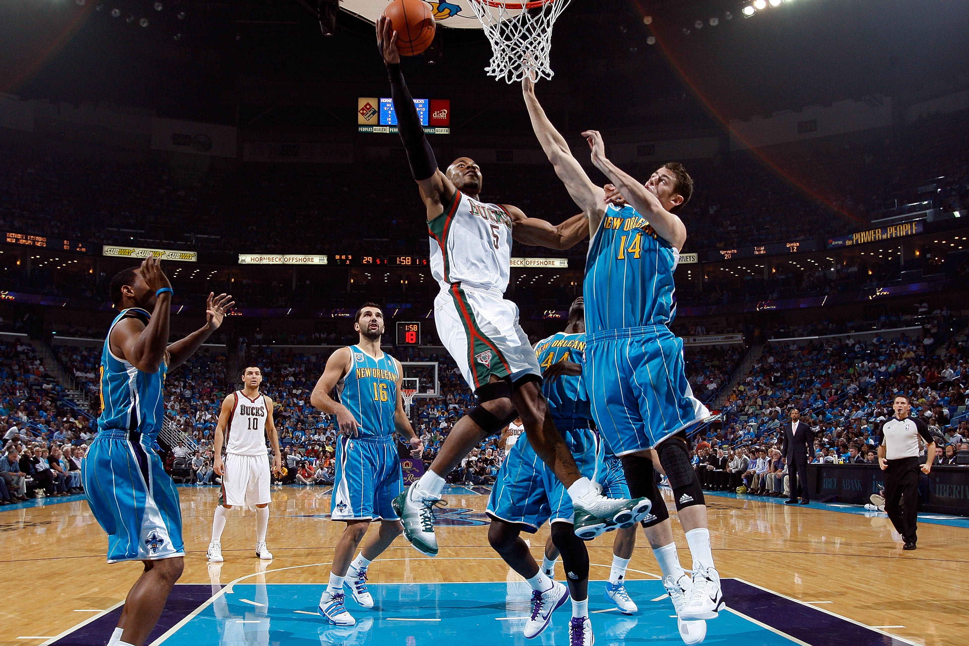 NEW ORLEANS - OCTOBER 27:  Corey Maggette #5 of the Milwaukee Bucks shoots the ball over Jason Smith #14 of the New Orleans Hornets at the New Orleans Arena on October 27, 2010 in New Orleans, Louisiana.  NOTE TO USER: User expressly acknowledges and agre