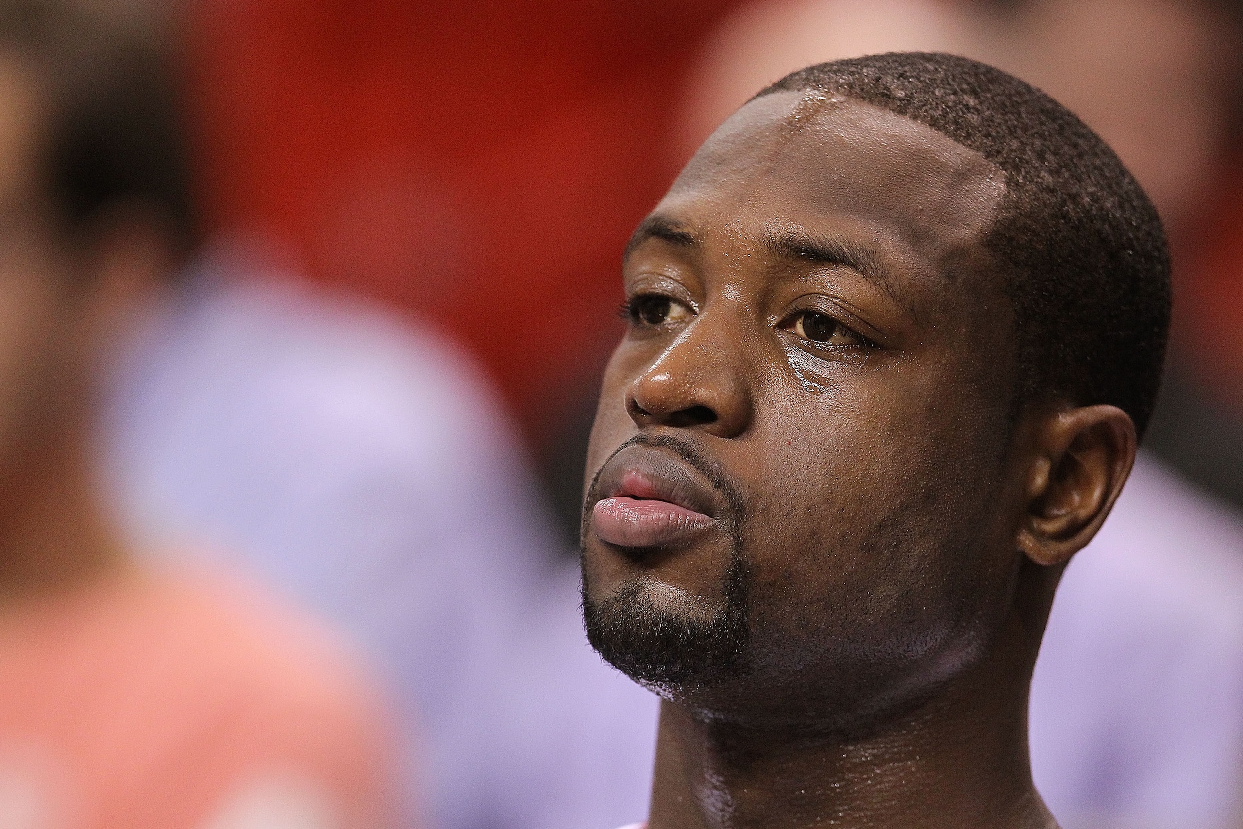 MIAMI - NOVEMBER 17:  Dwyane Wade #3 of the Miami Heat watches from the bench during a game against the Phoenix Suns at American Airlines Arena on November 17, 2010 in Miami, Florida. NOTE TO USER: User expressly acknowledges and agrees that, by downloadi