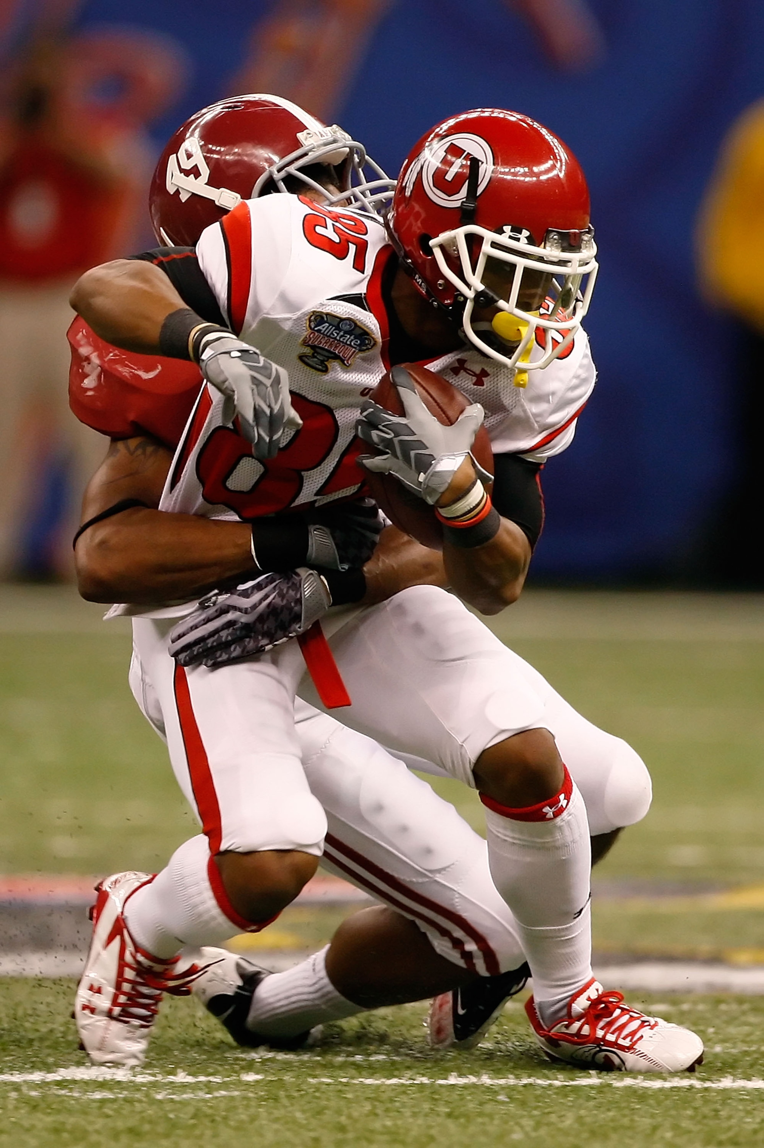 NEW ORLEANS - JANUARY 02:  Wide receiver Jereme Brooks #85 of the Utah Utes is tackled by defensive back Rashad Johnson #49 of the Alabama Crimson Tide in the second half during the 75th Allstate Sugar Bowl at the Louisiana Superdome on January 2, 2009 in