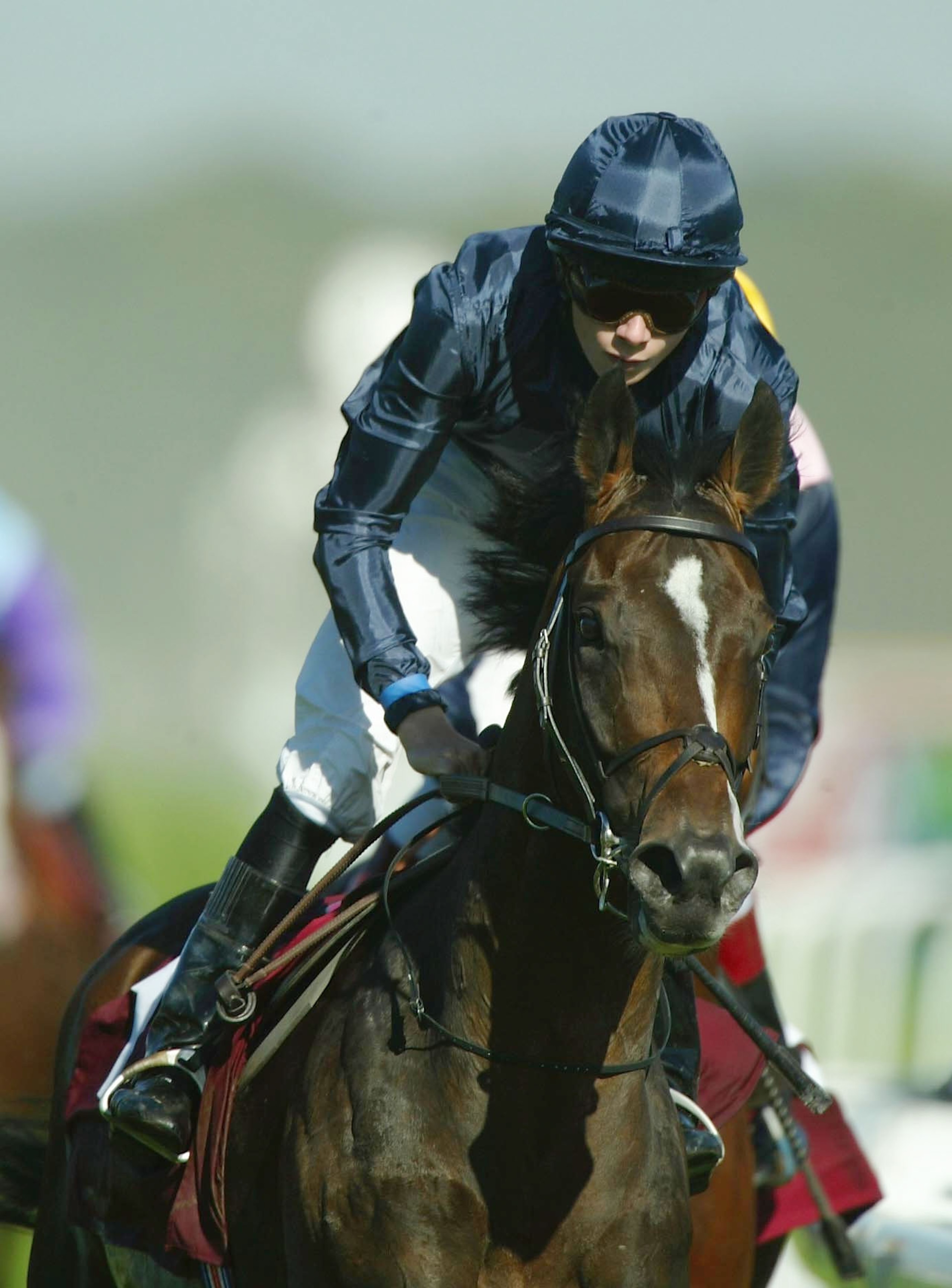 DONCASTER, ENGLAND - SEPTEMBER 13:   Jamie Spencer and Brian Boru (blue colours) land The Seabiscuit St Leger Stakes Race run at Doncaster Racecourse on September 13, 2003 in Doncaster, England. (Photo by Julian Herbert/Getty Images)
