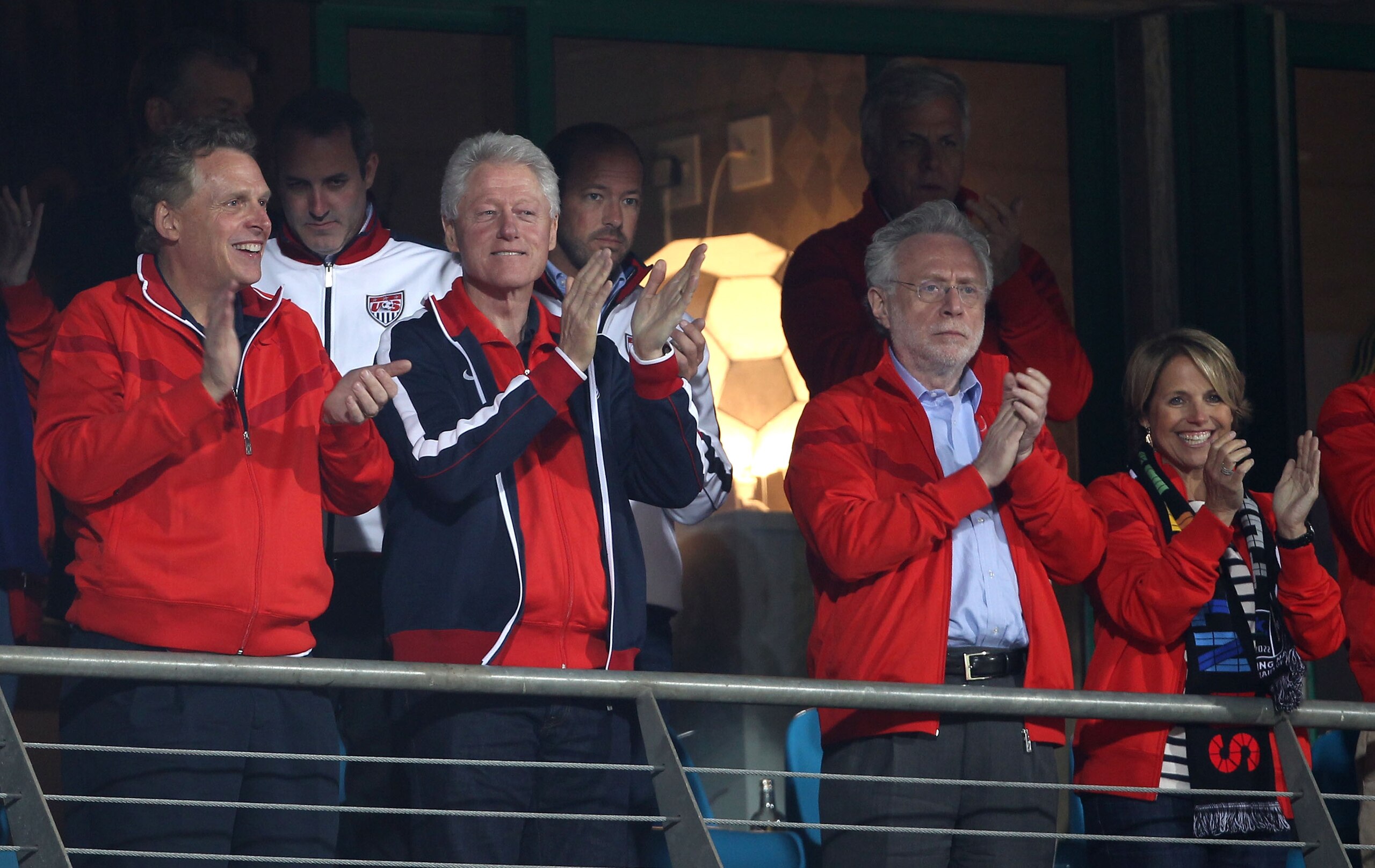 RUSTENBURG, SOUTH AFRICA - JUNE 26:  Former US President Bill Clinton stands for the national anthem with US news anchors Wolf Blitzer (2ndR) and Katie Couric (R) prior to the 2010 FIFA World Cup South Africa Round of Sixteen match between USA and Ghana a