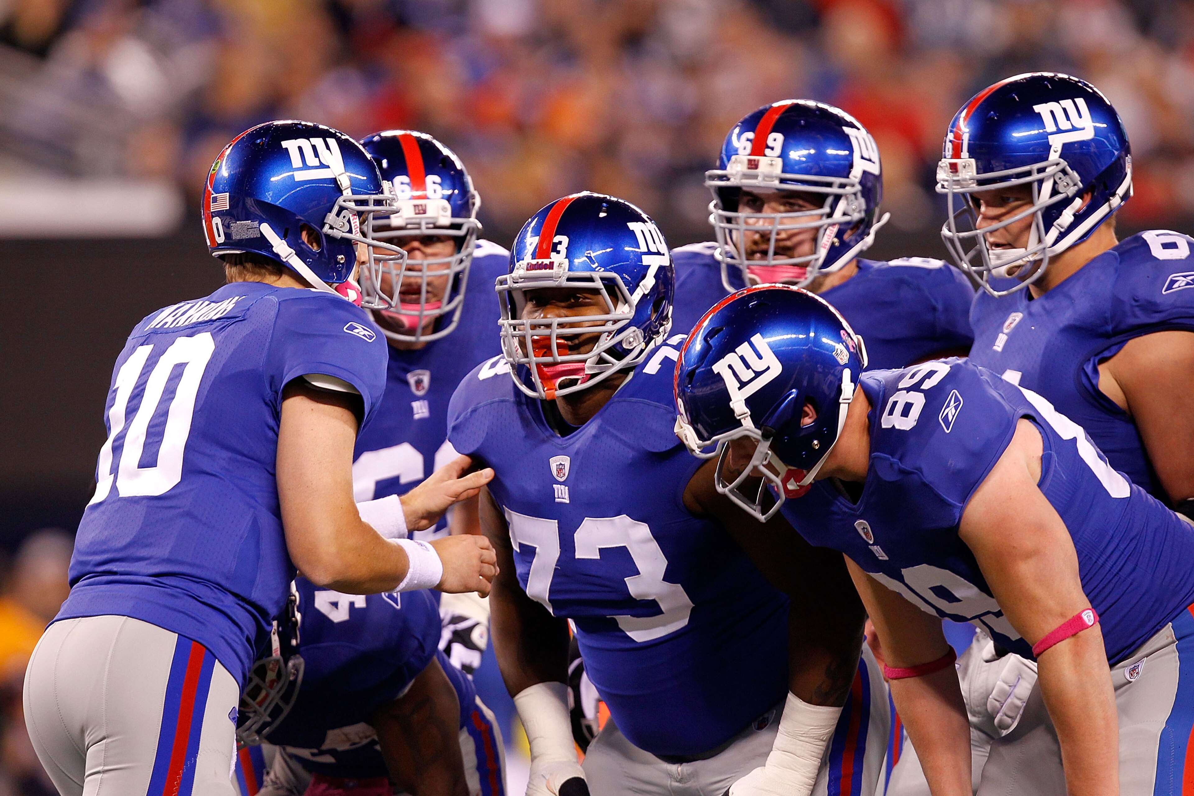 EAST RUTHERFORD, NJ - OCTOBER 03: Eli Manning #10 of the New York Giants talks to David Diehl #66, Shawn Andrews #73, Rich Seubert #69, Adam Koets #61 and Kevin Boss #89 in the huddle against the Chicago Bears at New Meadowlands Stadium on October 3, 201 EAST RUTHERFORD, NJ - OCTOBER 03: Eli Manning #10 of the New York Giants talks to David Diehl #66, Shawn Andrews #73, Rich Seubert #69, Adam Koets #61 and Kevin Boss #89 in the huddle against the Chicago Bears at New Meadowlands Stadium on October 3, 201