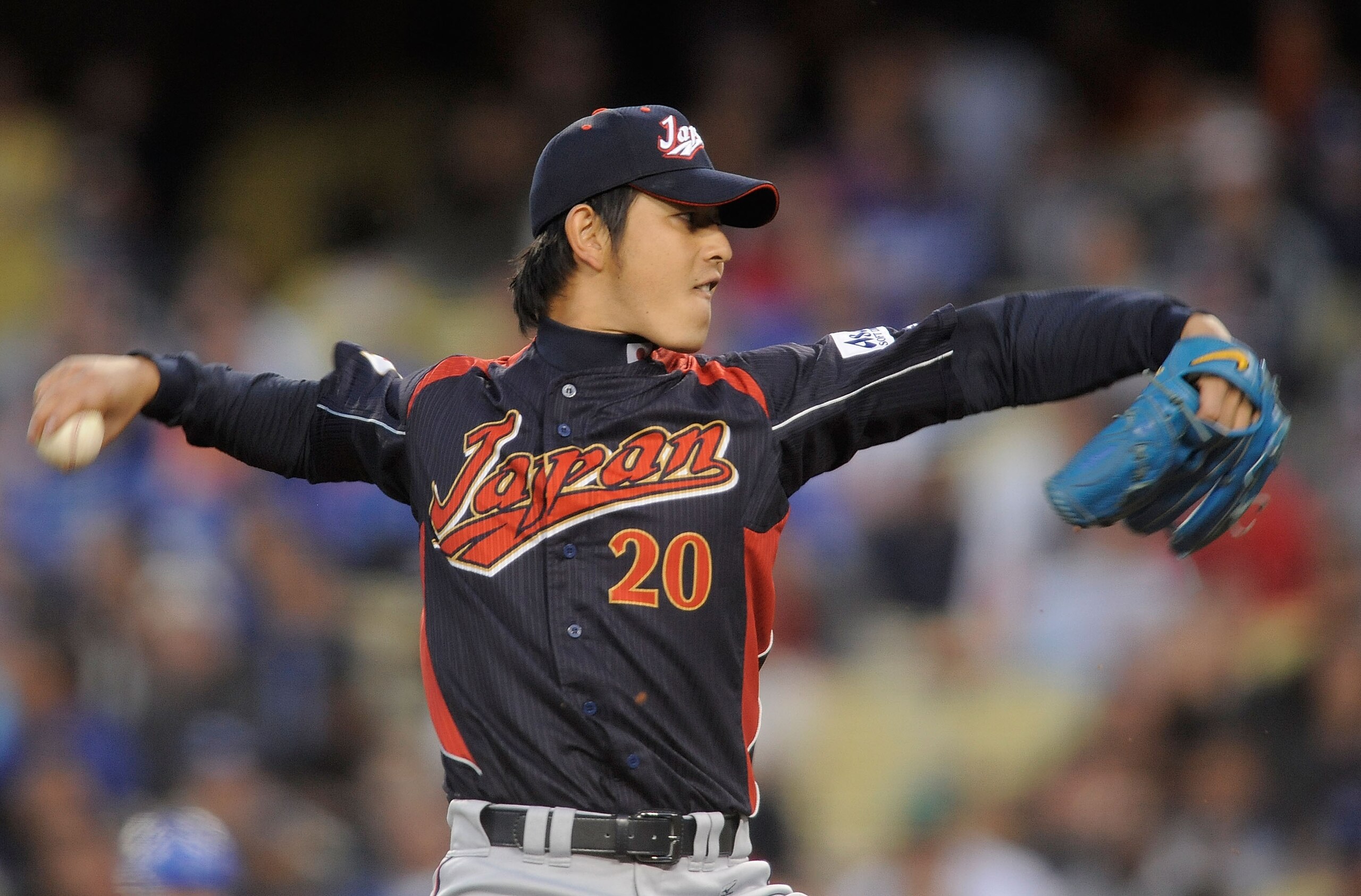 LOS ANGELES, CA - MARCH 23: Starting pitcher Hisashi Iwakuma #20 of Japan delivers a pitch against Korea in the first inning of the finals of the 2009 World Baseball Classic on March 23, 2009 at Dodger Stadium in Los Angeles, California. (Photo by Kevor LOS ANGELES, CA - MARCH 23: Starting pitcher Hisashi Iwakuma #20 of Japan delivers a pitch against Korea in the first inning of the finals of the 2009 World Baseball Classic on March 23, 2009 at Dodger Stadium in Los Angeles, California. (Photo by Kevor