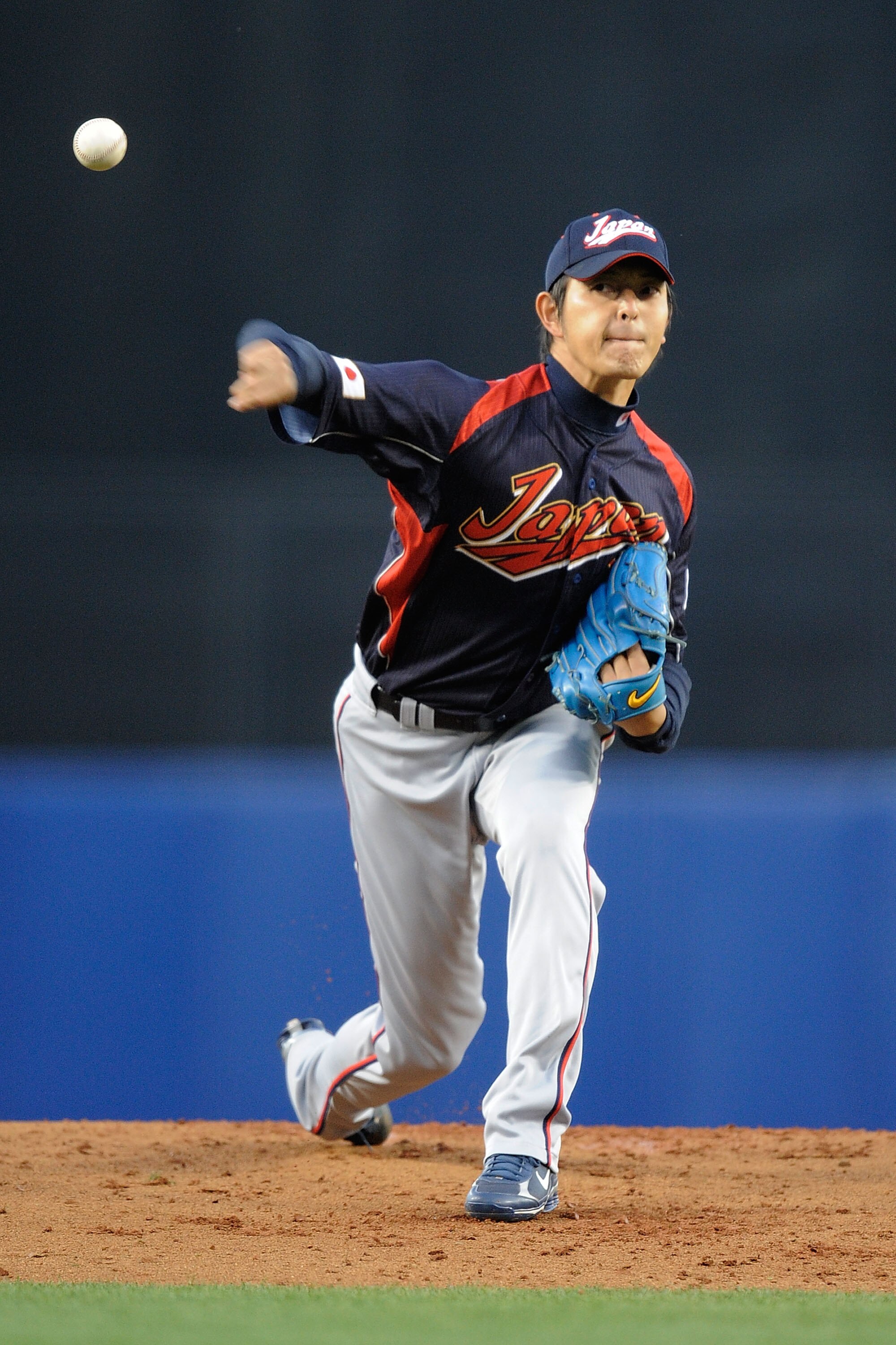 LOS ANGELES, CA - MARCH 23:  Starting pitcher Hisashi Iwakuma #20 of Japan delivers a pitch against Korea in the first inning of the finals of the 2009 World Baseball Classic on March 23, 2009 at Dodger Stadium in Los Angeles, California.  (Photo by Pool/