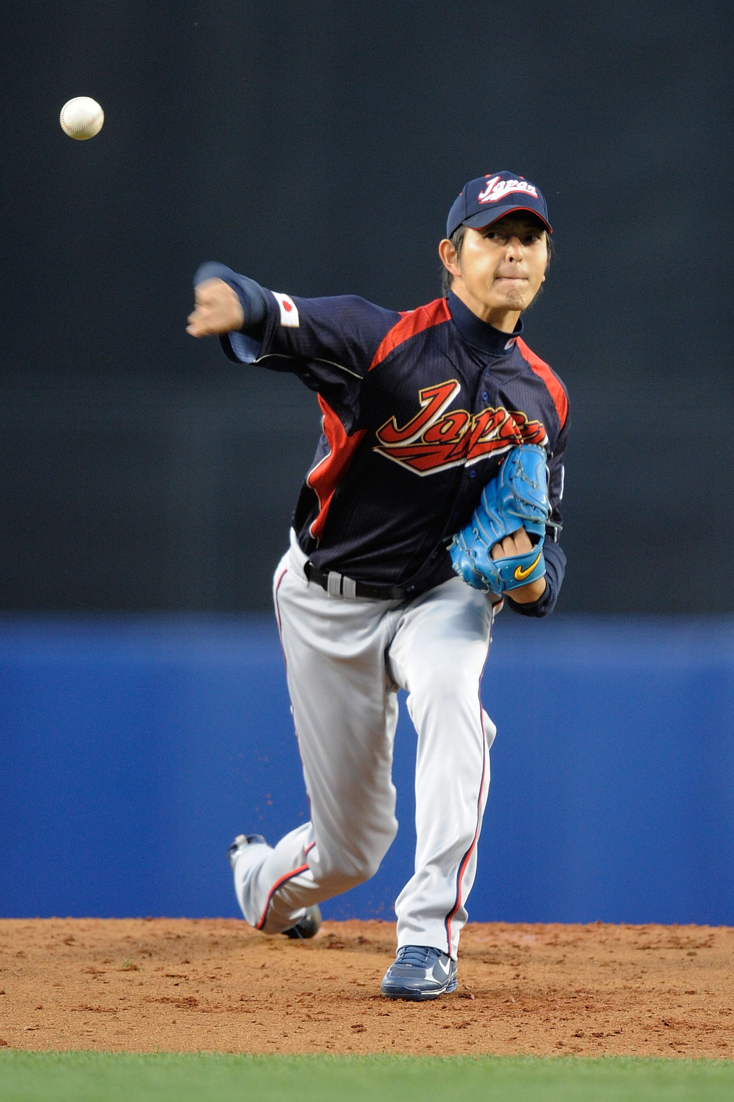 LOS ANGELES, CA - MARCH 23: Starting pitcher Hisashi Iwakuma #20 of Japan delivers a pitch against Korea in the first inning of the finals of the 2009 World Baseball Classic on March 23, 2009 at Dodger Stadium in Los Angeles, California. (Photo by Pool/ LOS ANGELES, CA - MARCH 23: Starting pitcher Hisashi Iwakuma #20 of Japan delivers a pitch against Korea in the first inning of the finals of the 2009 World Baseball Classic on March 23, 2009 at Dodger Stadium in Los Angeles, California. (Photo by Pool/