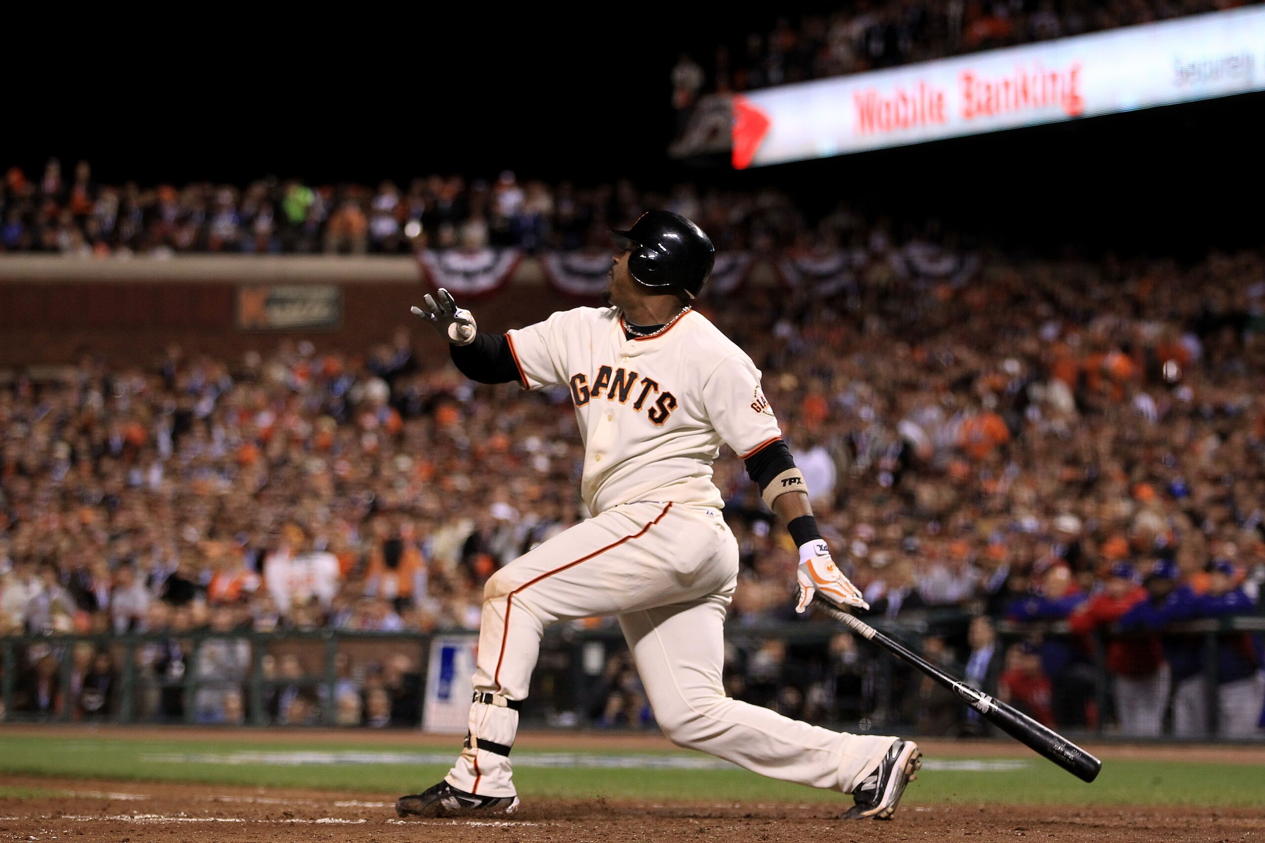 SAN FRANCISCO - OCTOBER 27:  Juan Uribe #5 of the San Francisco Giants hits a three run homerun in the fifth inning against Darren O'Day #56 of the Texas Rangers in Game One of the 2010 MLB World Series at AT&T Park on October 27, 2010 in San Francisco, C