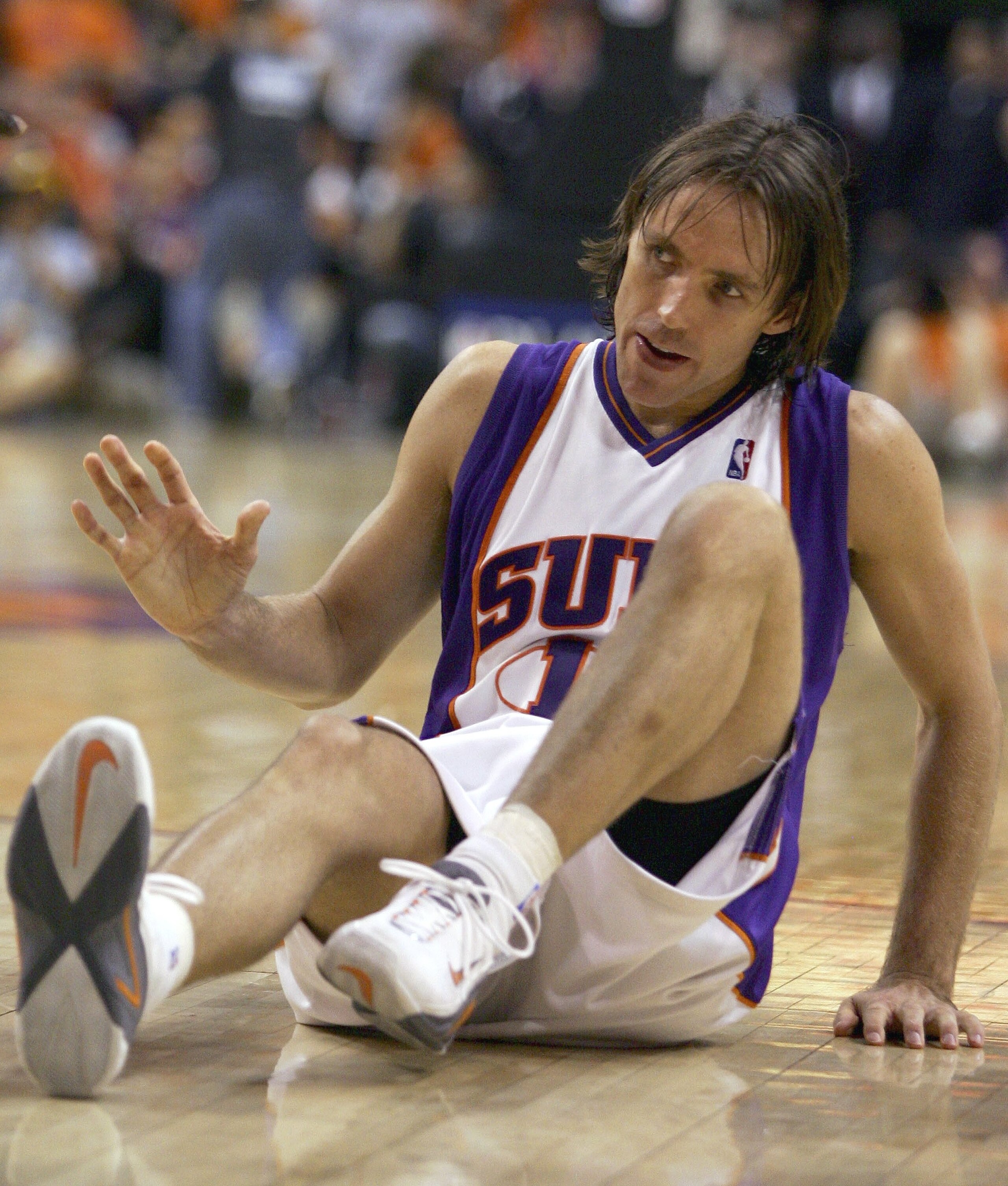 PHOENIX - MAY 6:  Steve Nash #13 of the Phoenix Suns falls to the floor in the second quarter of game seven of the Western Conference Quarterfinals against the Los Angeles Lakers during the 2006 NBA Playoffs at the US Airways Center on May 6, 2006 in Phoe