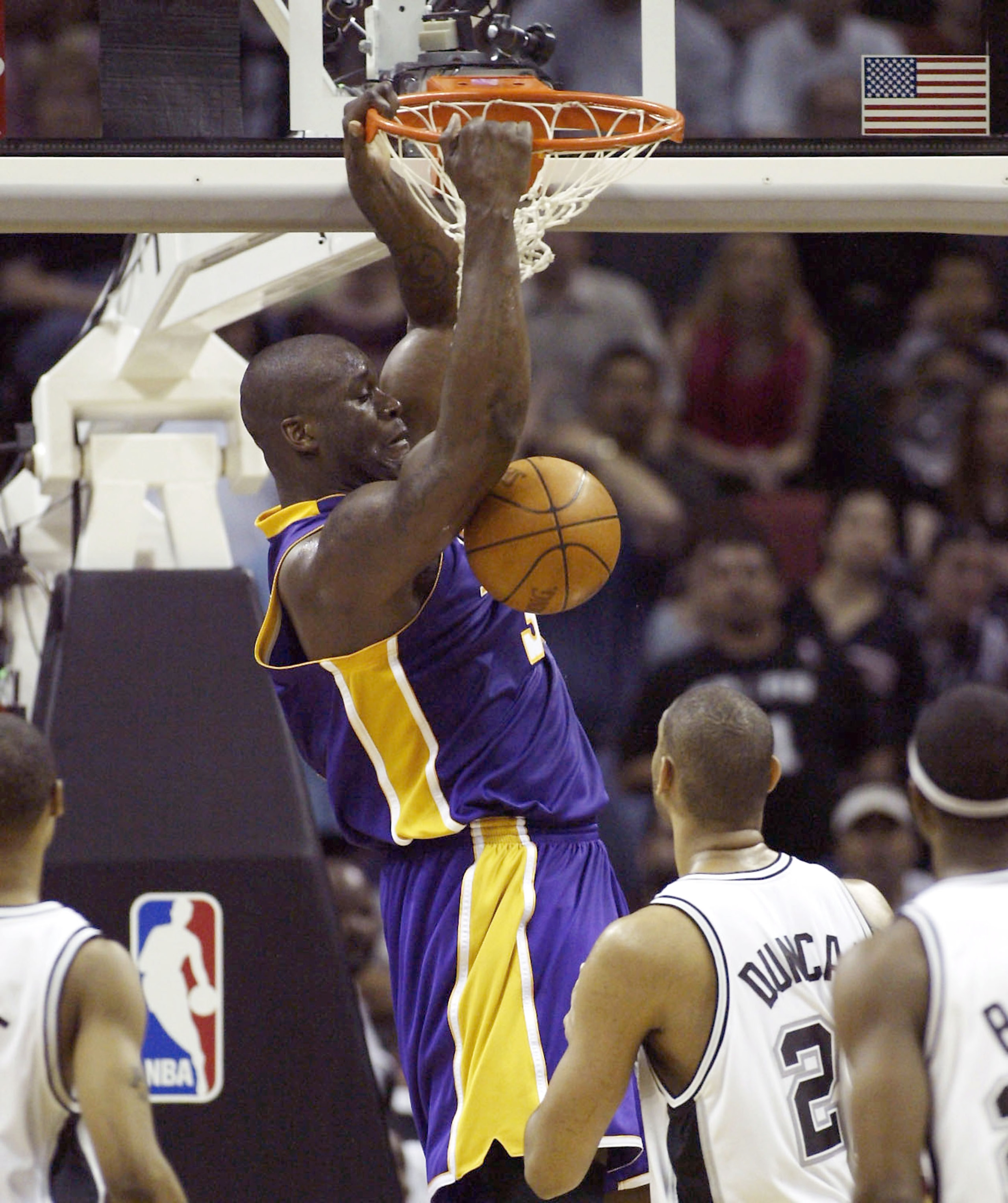 SAN ANTONIO  - MAY 2:  Shaquille O'Neal #34 of the Los Angeles Lakers dunks over Tim Duncan #21 of the San Antonio Spurs during Game one of the Western Conference Semifinals during the 2004 NBA Playoffs May 2, 2004 at the SBC Center in San Antonio, Texas.