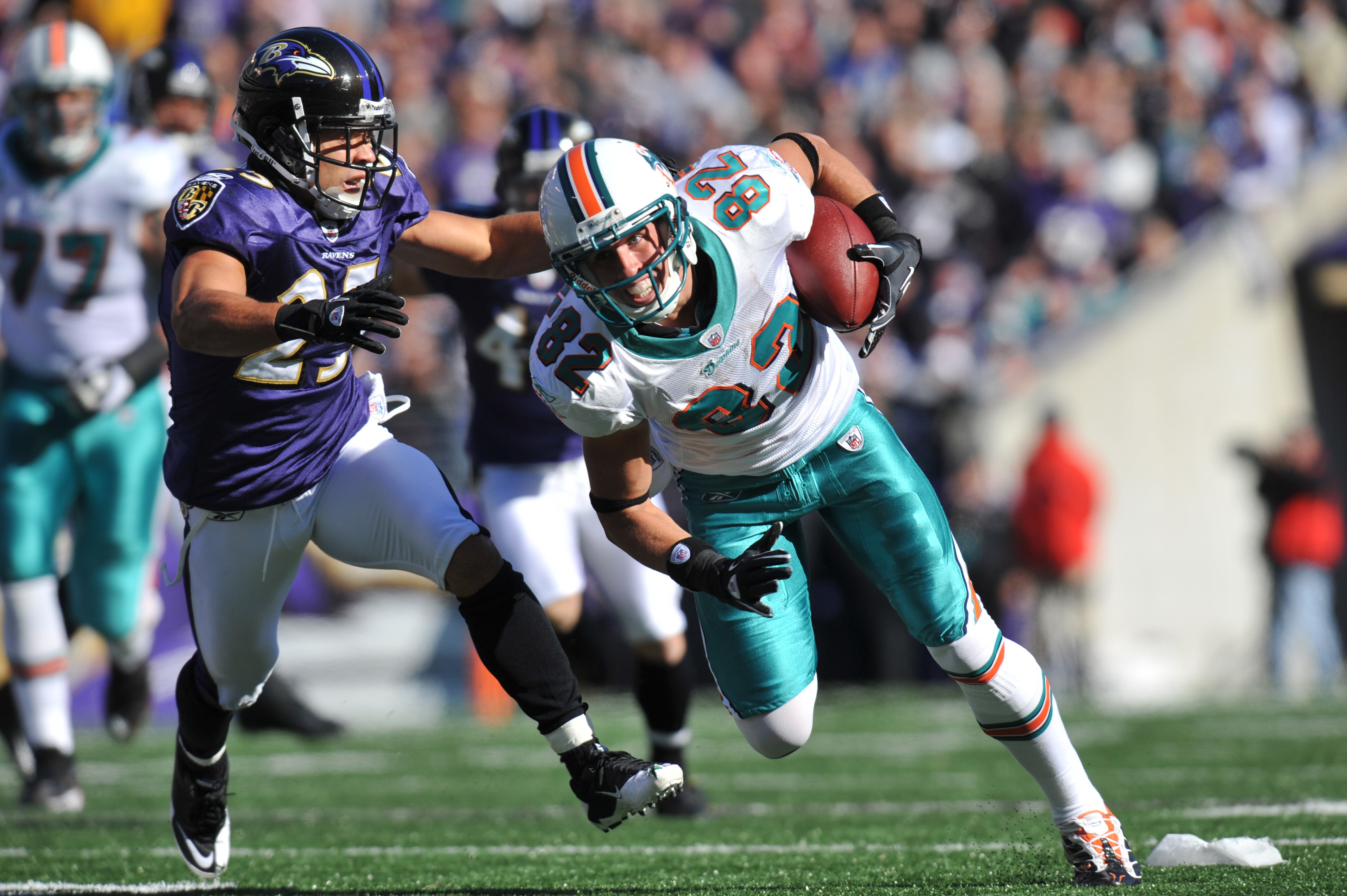 BALTIMORE, MD - NOVEMBER 7:  Brian Hartline #82 of the Miami Dolphins runs the ball against the Baltimore Ravens at M&T Bank Stadium on November 7, 2010 in Baltimore, Maryland. The Ravens defeated the Dolphins 26-10. (Photo by Larry French/Getty Images)