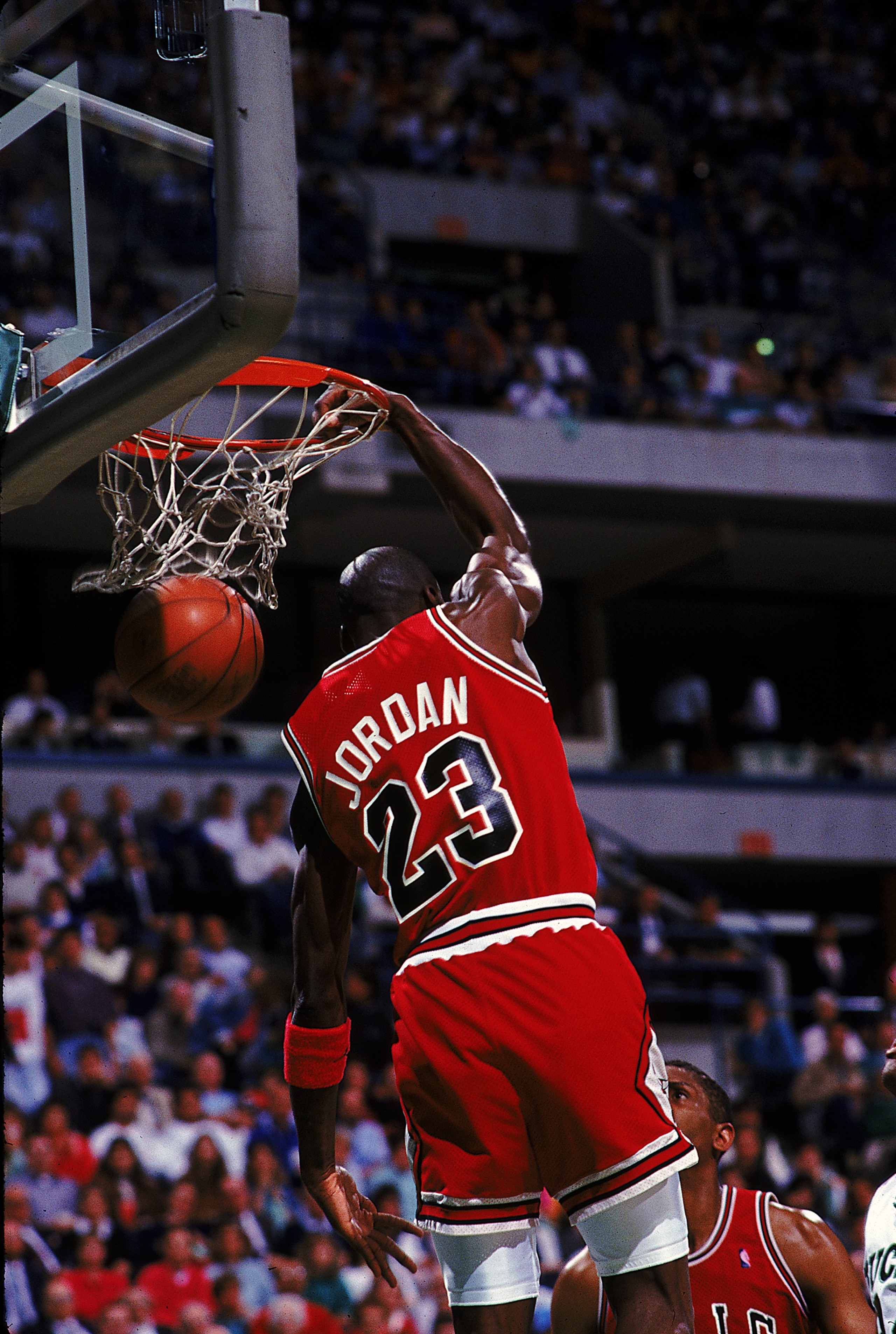 1990:  Michael Jordan #23 of the Chicago Bulls dunks the ball during the game.   Mandatory Credit