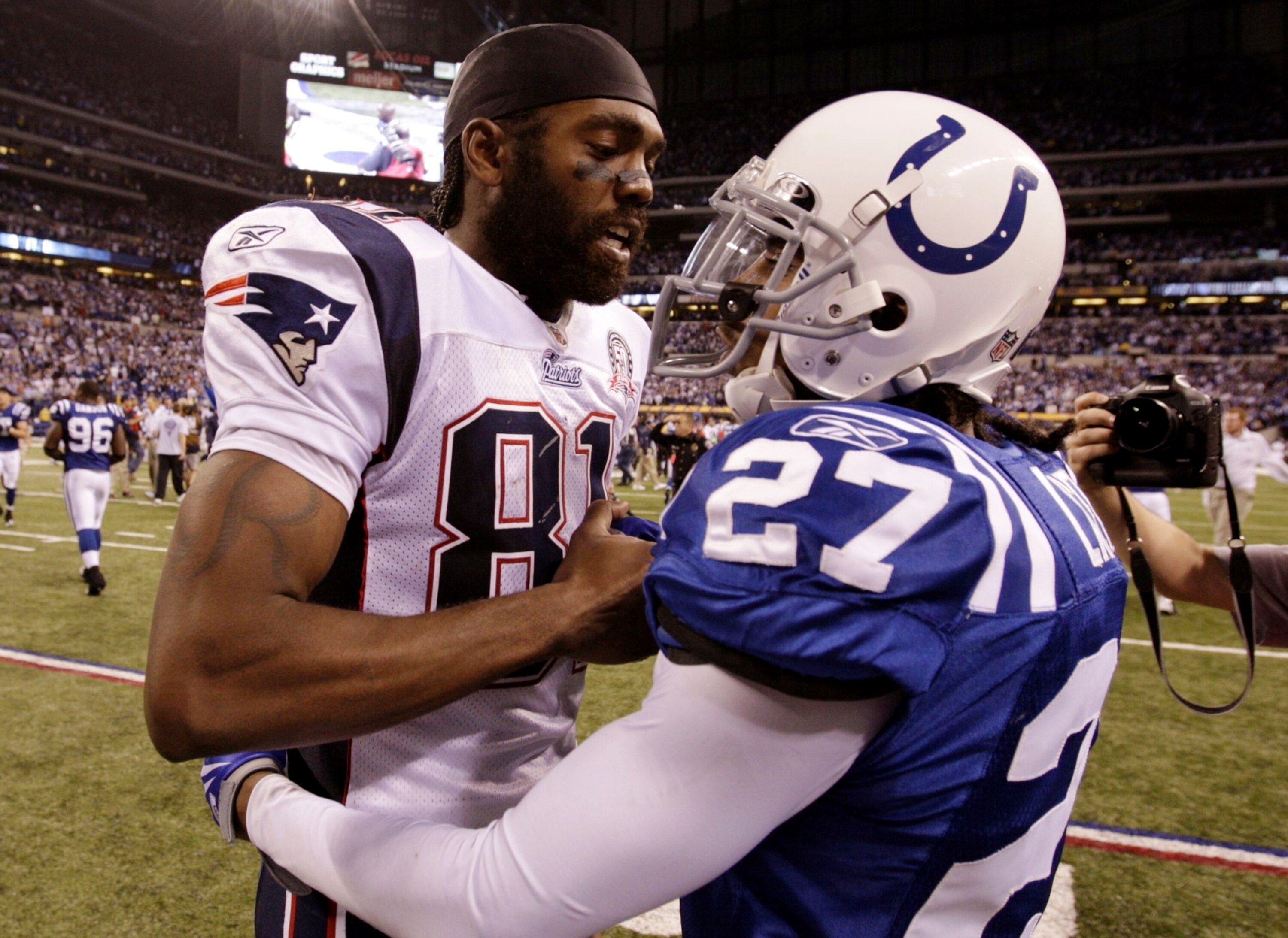 INDIANAPOLIS - NOVEMBER 15: Jacob Lacey #27 of the Indianapolis Colts greets Randy Moss #81 of the New England Patriots after the game at Lucas Oil Stadium on November 15, 2009 in Indianapolis, Indiana. The Colts won the game 35-34.  (Photo by Andy Lyons/