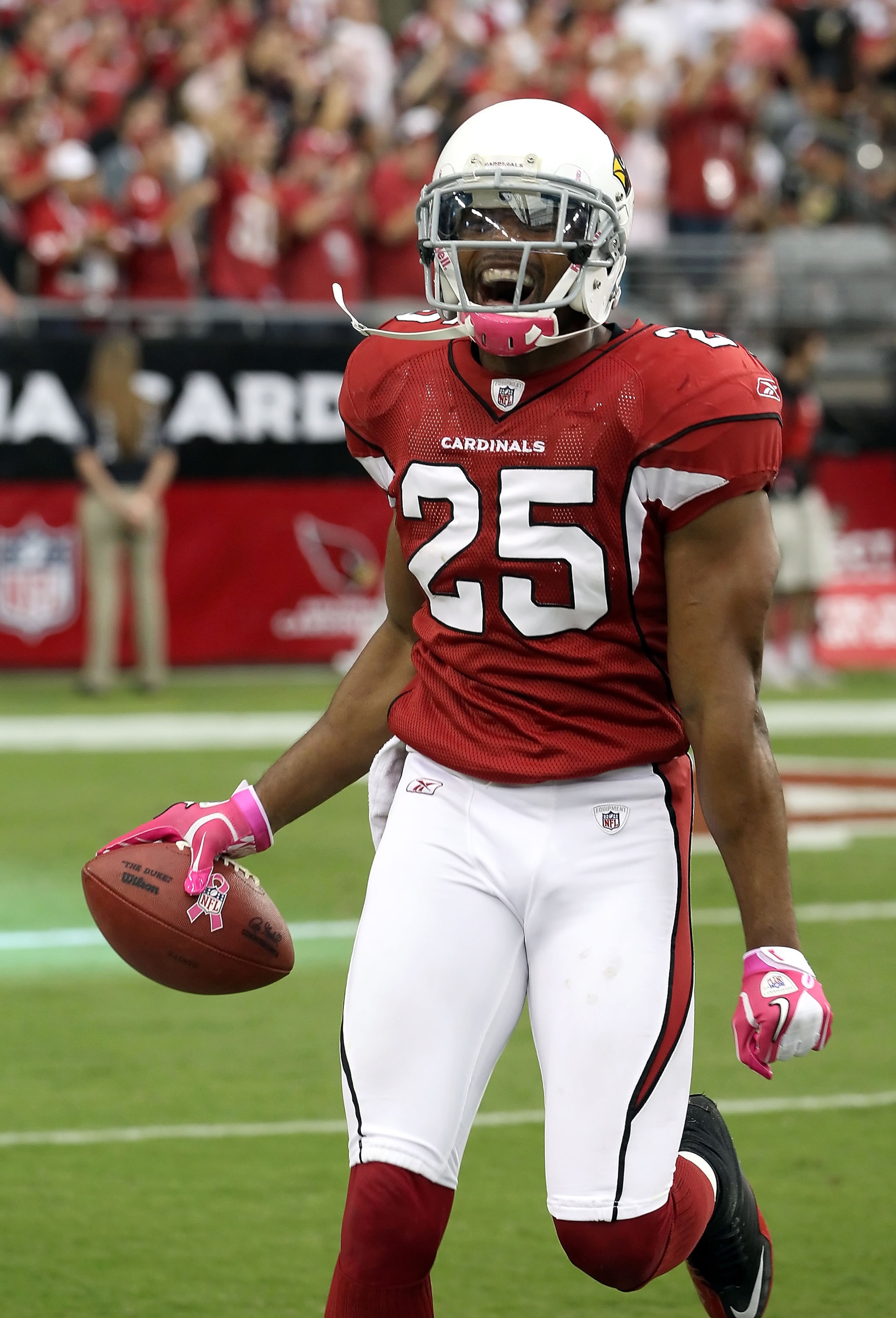 GLENDALE, AZ - OCTOBER 10:  Safety Kerry Rhodes #25 of the Arizona Cardinals celebrates after scoring a touchdown on a fumble recovery during the fourth quarter of the NFL game against the New Orleans Saints at the University of Phoenix Stadium on October