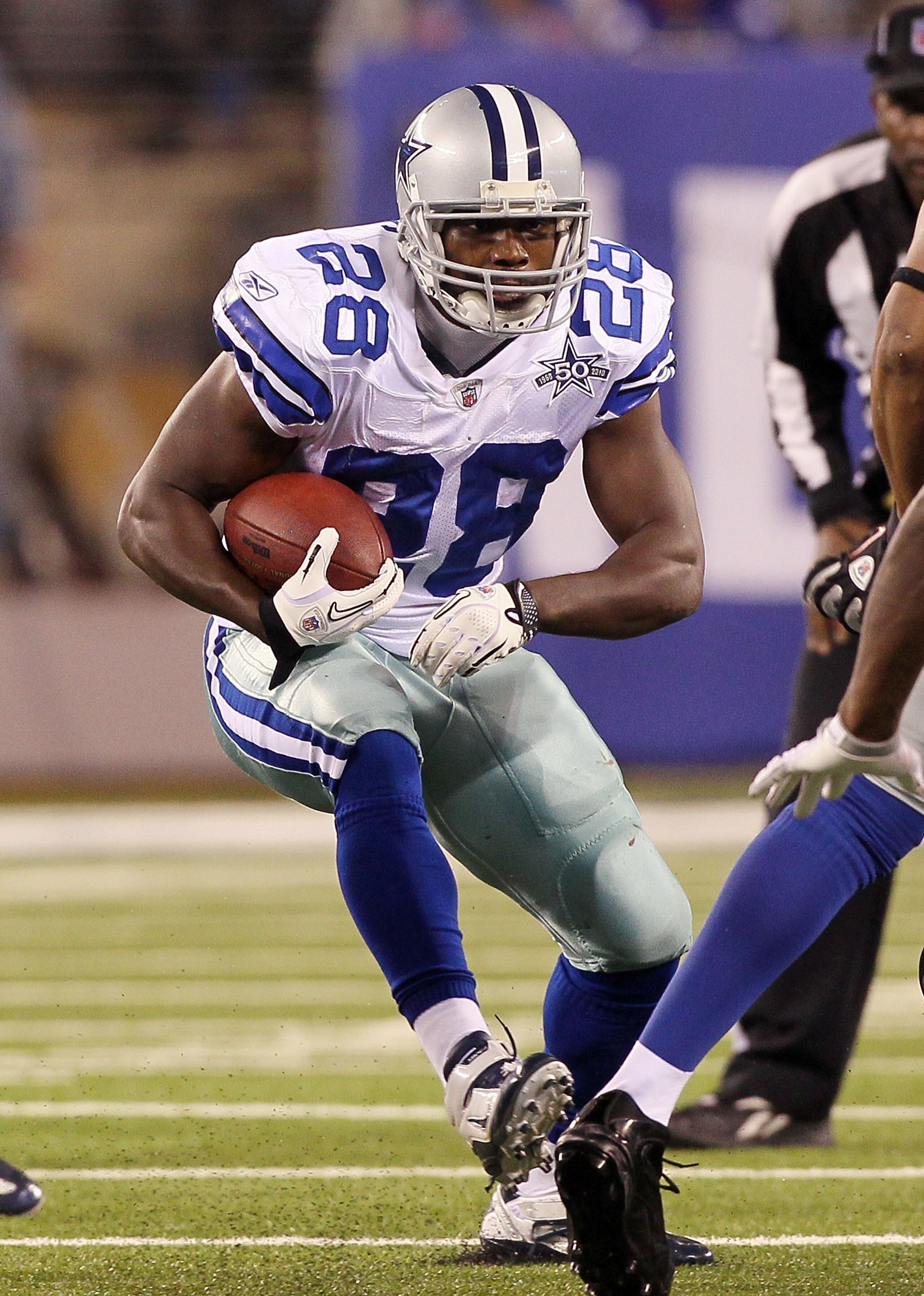 EAST RUTHERFORD, NJ - NOVEMBER 14: Felix Jones #28 of the Dallas Cowboys runs against the New York Giants on November 14, 2010 at the New Meadowlands Stadium in East Rutherford, New Jersey. The Cowboys defeated the Giants 33-20.  (Photo by Jim McIsaac/Get