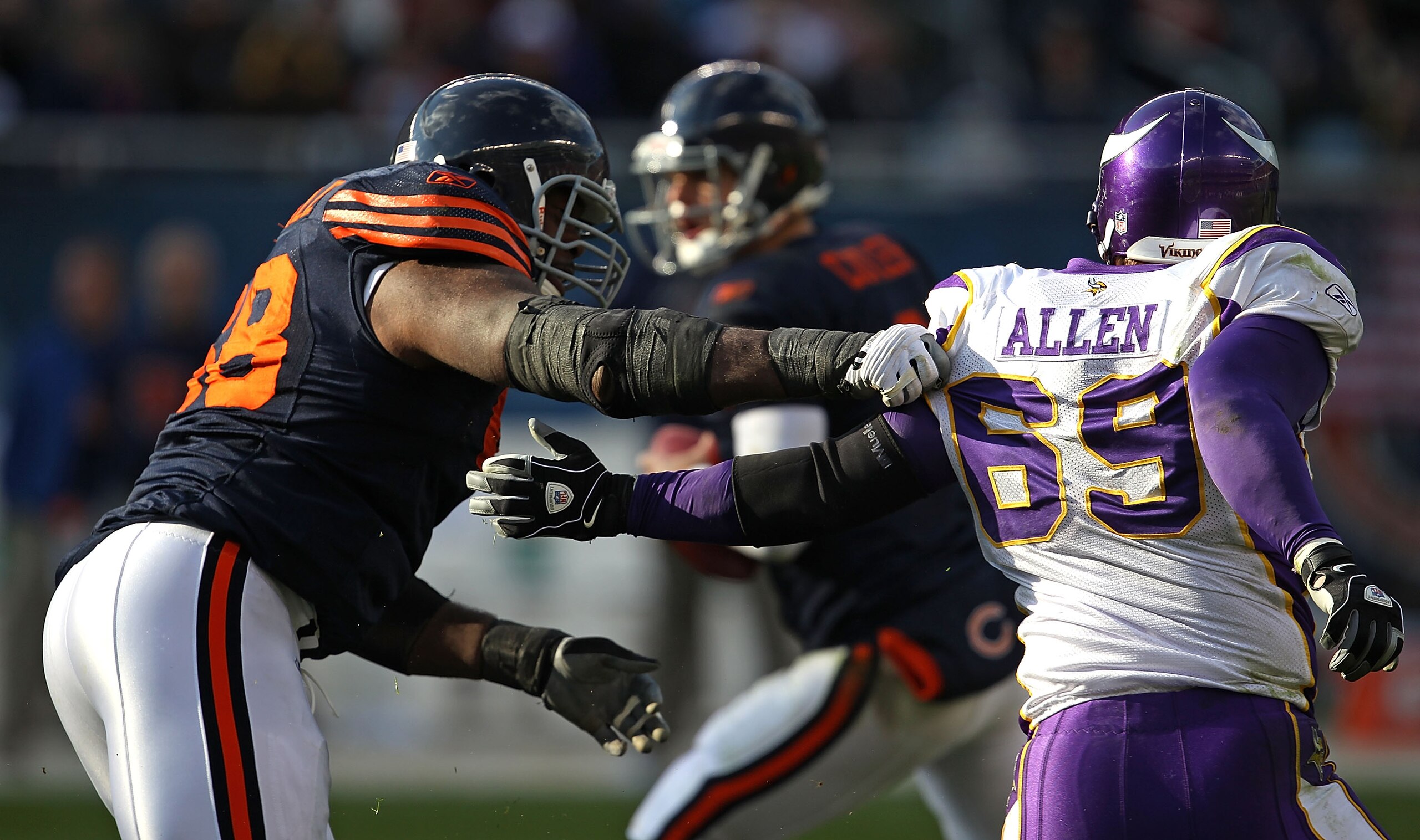 CHICAGO - NOVEMBER 14: Frank Omiyale #68 of the Chicago Bears grabs Jared Allen #69 of the Minnesota Vikings at Soldier Field on November 14, 2010 in Chicago, Illinois. The Bears defeated the Vikings 27-13. (Photo by Jonathan Daniel/Getty Images)