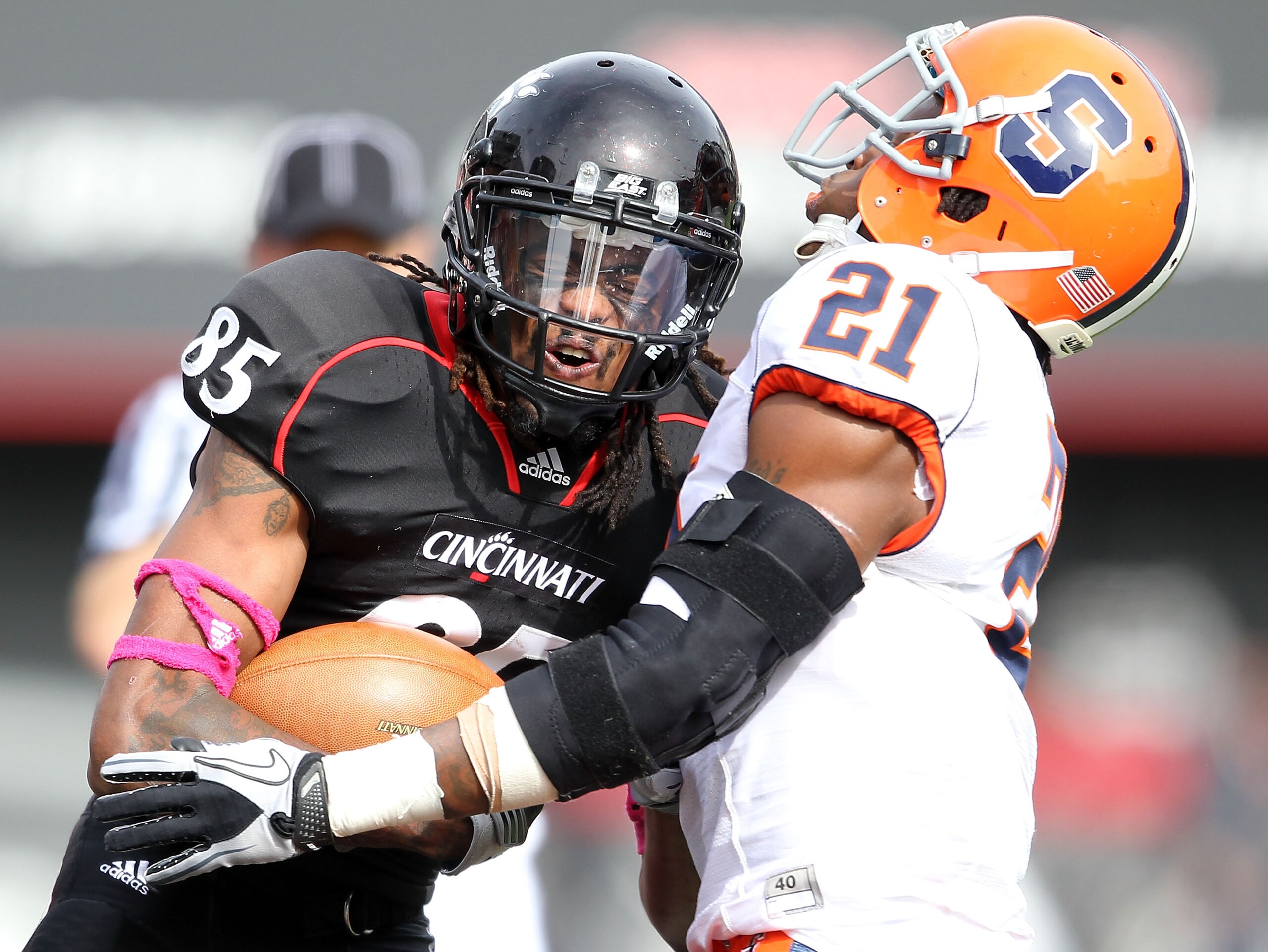 CINCINNATI - OCTOBER 30: Marcus Barnett #85 of the Cincinnati Bearcats is tackled by Shamarko Thomas #21 of the Syracuse Orange during the Big East Conference game at Nippert Stadium on October 30, 2010 in Cincinnati, Ohio. (Photo by Andy Lyons/Getty Im CINCINNATI - OCTOBER 30: Marcus Barnett #85 of the Cincinnati Bearcats is tackled by Shamarko Thomas #21 of the Syracuse Orange during the Big East Conference game at Nippert Stadium on October 30, 2010 in Cincinnati, Ohio. (Photo by Andy Lyons/Getty Im