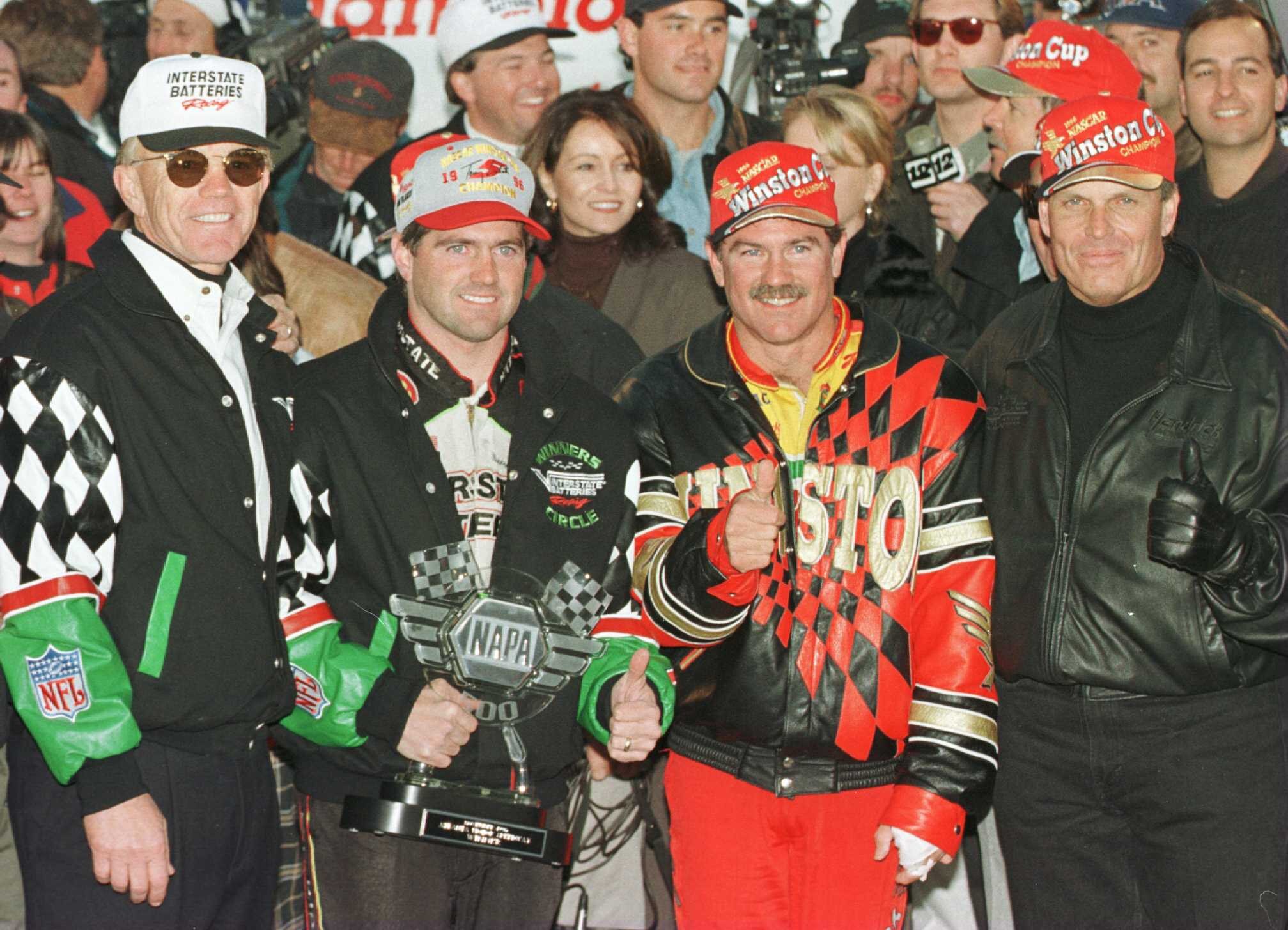 10 Nov 1996:  Team owner Joe Gibbs (left), drivers Bobby Labonte, Terry LaBonte (center right) and team owner Rick Hendrick (right) celebrate after the NAPA 500 NASCAR event at Atlanta Motor Speedway in Hampton, Georgia. Terry Labonte finished fifth andca