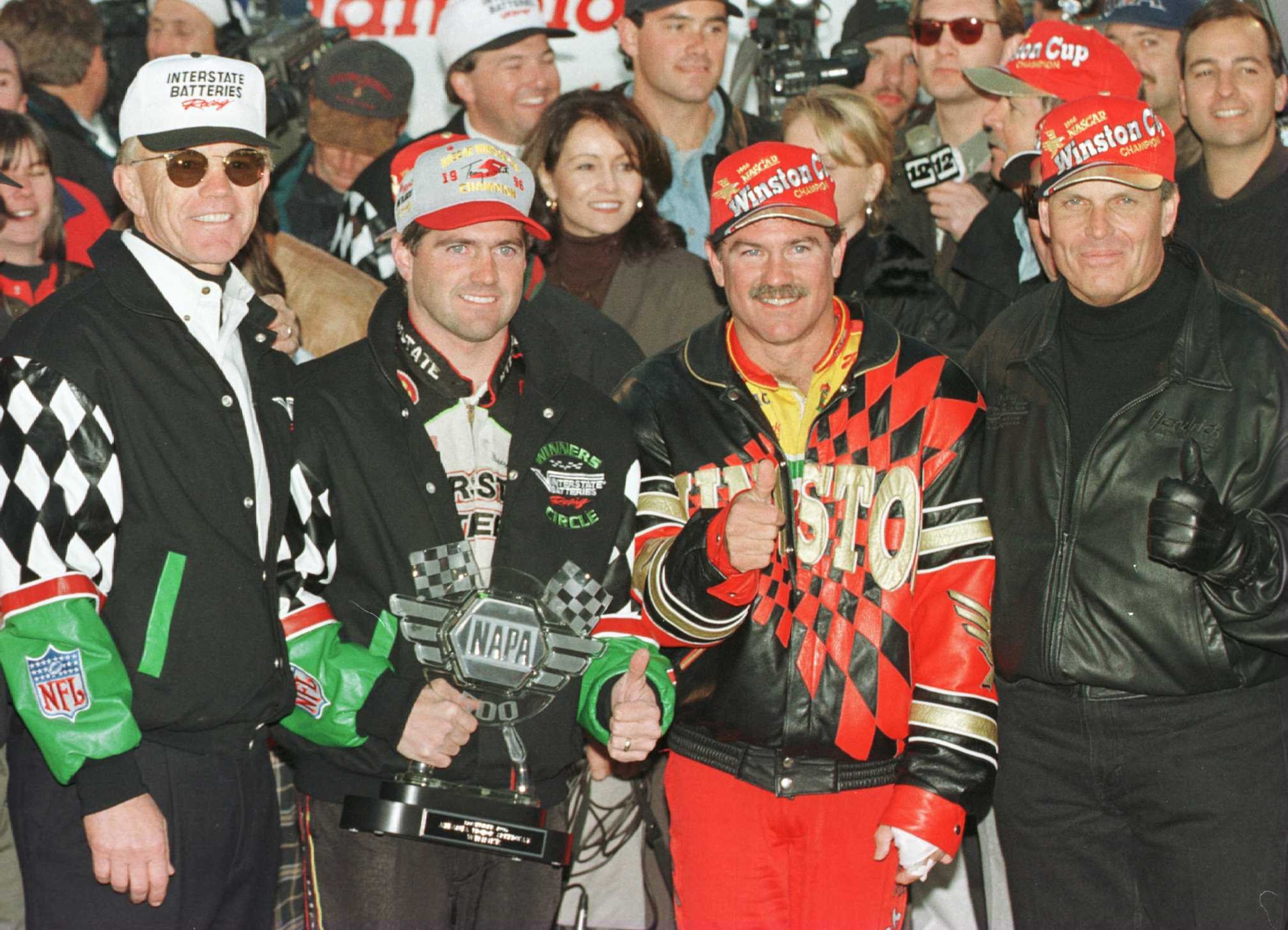 10 Nov 1996: Team owner Joe Gibbs (left), drivers Bobby Labonte, Terry LaBonte (center right) and team owner Rick Hendrick (right) celebrate after the NAPA 500 NASCAR event at Atlanta Motor Speedway in Hampton, Georgia. Terry Labonte finished fifth andca 10 Nov 1996: Team owner Joe Gibbs (left), drivers Bobby Labonte, Terry LaBonte (center right) and team owner Rick Hendrick (right) celebrate after the NAPA 500 NASCAR event at Atlanta Motor Speedway in Hampton, Georgia. Terry Labonte finished fifth andca