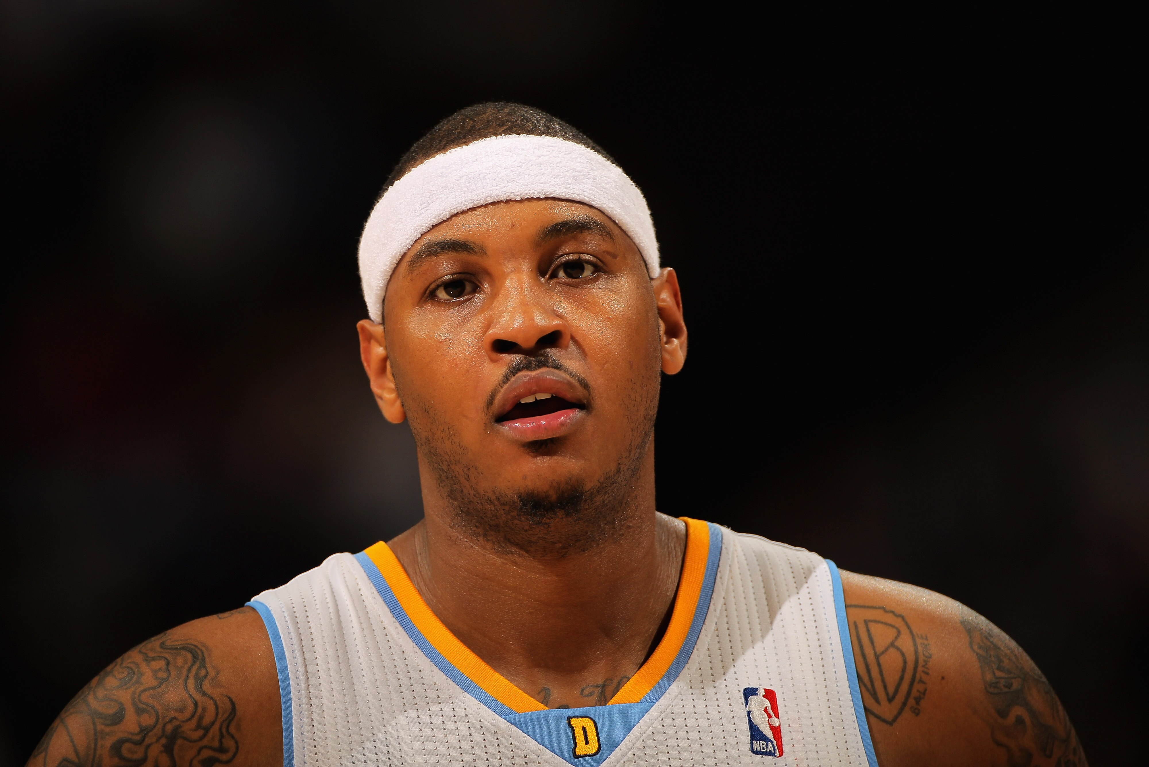 DENVER - NOVEMBER 16:  Carmelo Anthony #15 of the Denver Nuggets looks on during a break in the action against the New York Knicks at the Pepsi Center on November 16, 2010 in Denver, Colorado. The Nuggets defeated the Knicks 120-118. NOTE TO USER: User ex