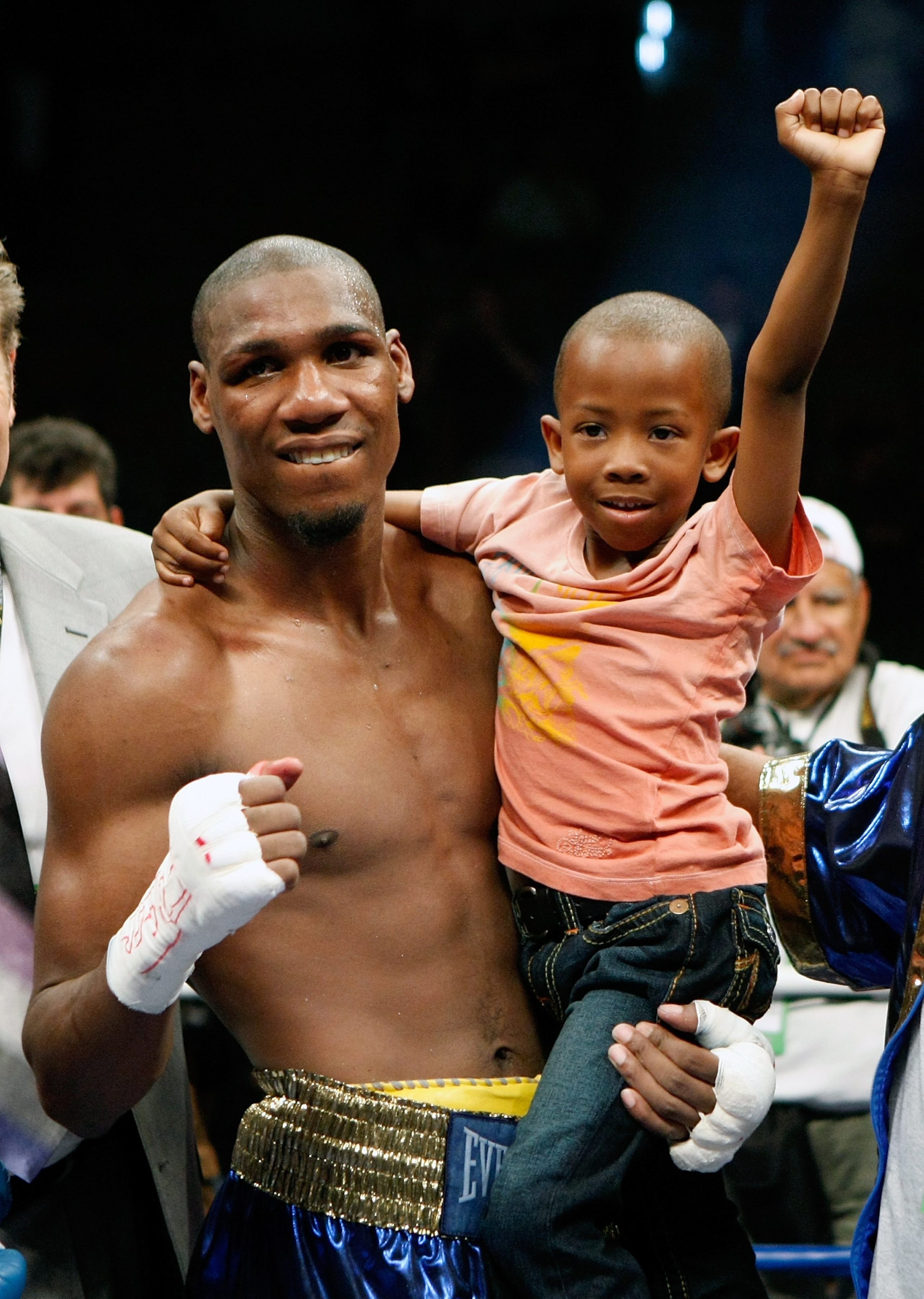LAS VEGAS - APRIL 11:  Paul Williams holds his son Paul Williams Jr. as he celebrates defeating Winky Wright in a unanimous decision in their middleweight bout at the Mandalay Bay Events Center April 11, 2009 in Las Vegas, Nevada.  (Photo by Ethan Miller/