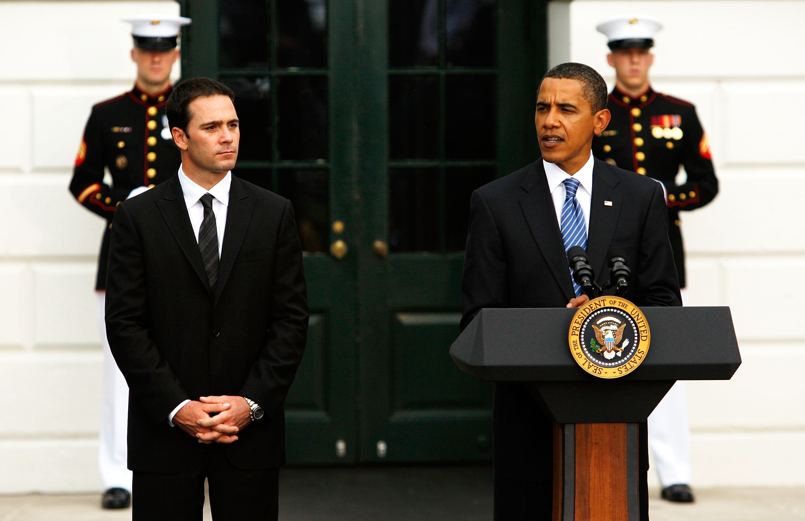 WASHINGTON - AUGUST 19: U.S. President Barack Obama (R) speaks as 2008 NASCAR Sprint Cup Champion Jimmie Johnson (L) listens during a South Portico event at the White House August 19, 2009 in Washington, DC. Obama hosted the NASCAR champion and other dri WASHINGTON - AUGUST 19: U.S. President Barack Obama (R) speaks as 2008 NASCAR Sprint Cup Champion Jimmie Johnson (L) listens during a South Portico event at the White House August 19, 2009 in Washington, DC. Obama hosted the NASCAR champion and other dri