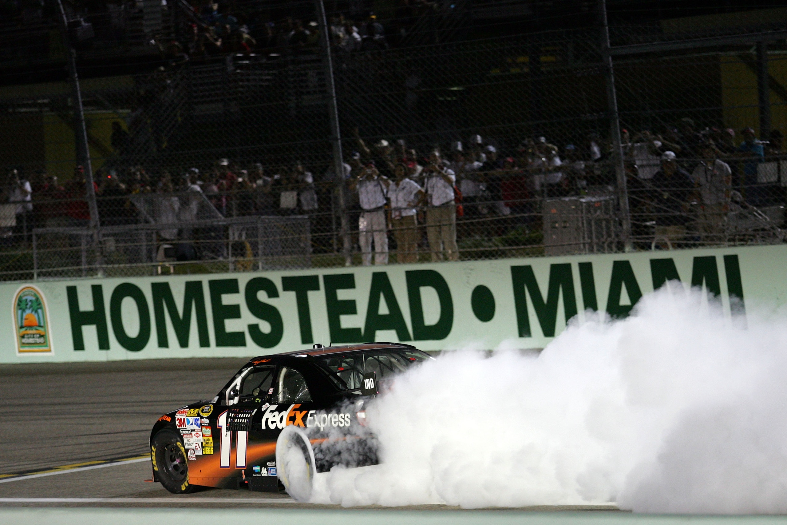 HOMESTEAD, FL - NOVEMBER 22: Denny Hamlin, driver of the #11 FedEx Express Toyota, does a burnout after winning the NASCAR Sprint Cup Series Ford 400 at Homestead-Miami Speedway on November 22, 2009 in Homestead, Florida. (Photo by Todd Warshaw/Getty Im HOMESTEAD, FL - NOVEMBER 22: Denny Hamlin, driver of the #11 FedEx Express Toyota, does a burnout after winning the NASCAR Sprint Cup Series Ford 400 at Homestead-Miami Speedway on November 22, 2009 in Homestead, Florida. (Photo by Todd Warshaw/Getty Im
