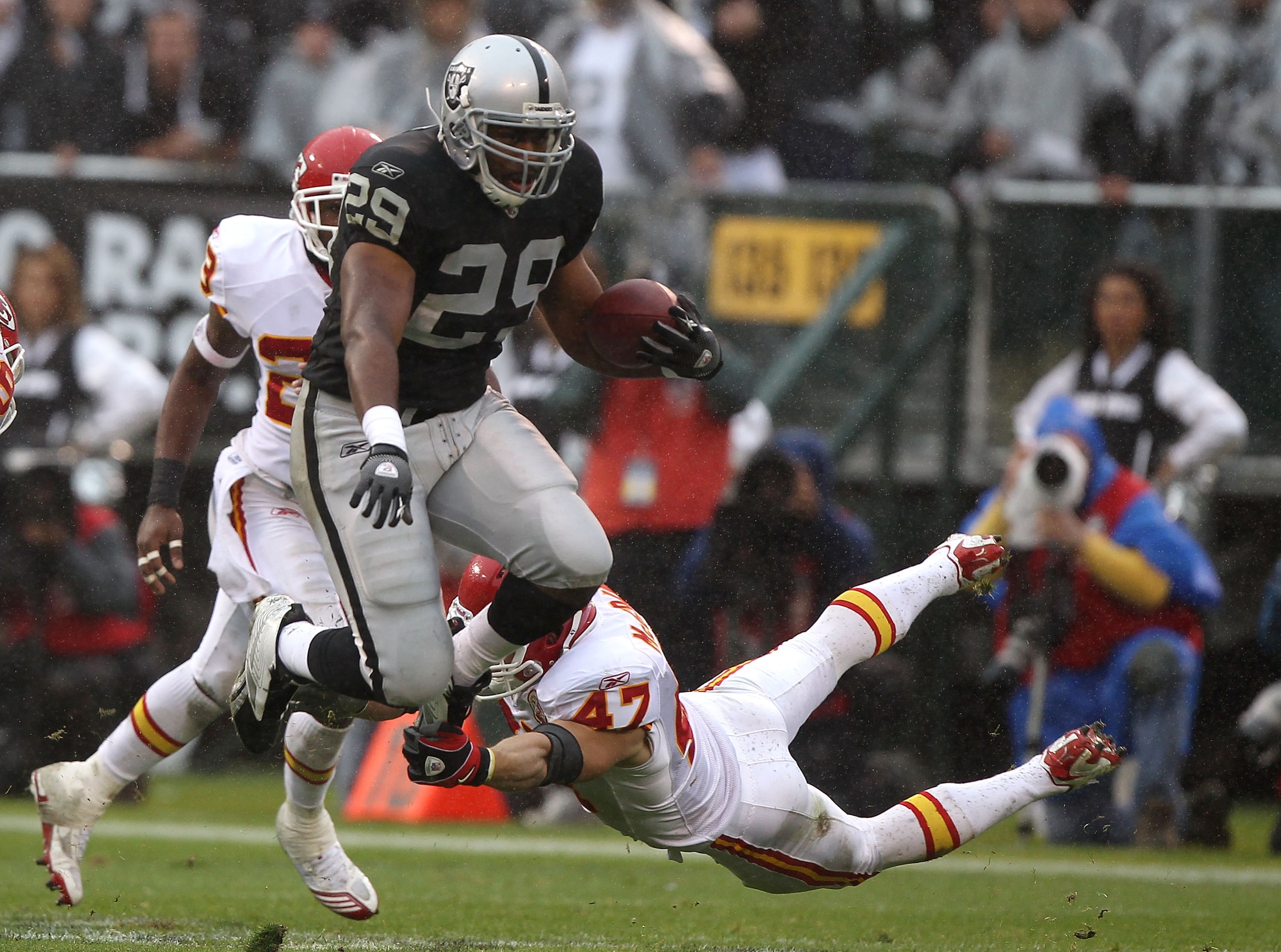 OAKLAND, CA - NOVEMBER 07: Michael Bush #29 of the Oakland Raiders runs against Jon McGraw #47 of the Kansas City Chiefs during an NFL game at Oakland-Alameda County Coliseum on November 7, 2010 in Oakland, California. (Photo by Jed Jacobsohn/Getty Ima OAKLAND, CA - NOVEMBER 07: Michael Bush #29 of the Oakland Raiders runs against Jon McGraw #47 of the Kansas City Chiefs during an NFL game at Oakland-Alameda County Coliseum on November 7, 2010 in Oakland, California. (Photo by Jed Jacobsohn/Getty Ima